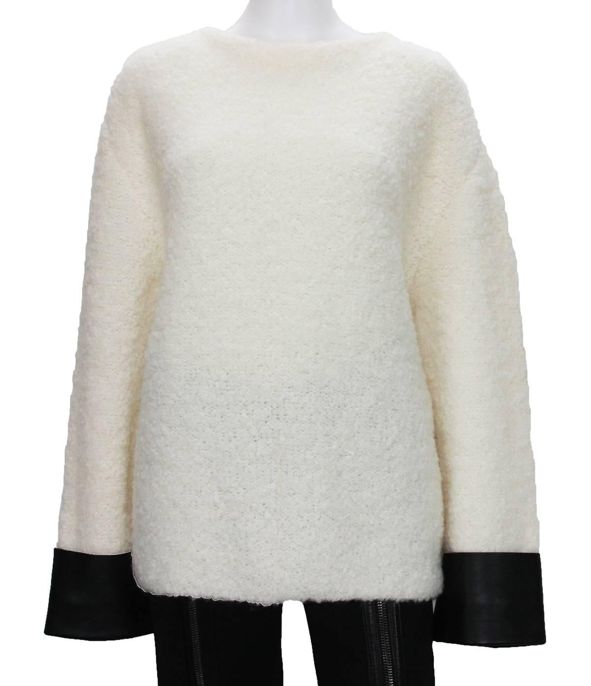 New GUCCI Boucle Wool Jumper Sweater with Leather Cuffs
Italian Size M
Standard Fit to Size, Designed for Oversize Fit (will fit size L also)
Colors – Cream and Black
61% Wool, 35% Alpaca, 4% Polyamide
Sleeve Cuffs – 100% Leather
Oversize Fit, Boat