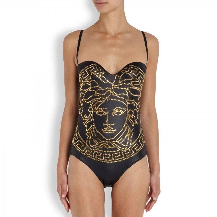 Brand new VERSACE swimsuit
Italian size 2
Color: Black
Gold Studs
Fabric content: 80% Polyamide, 20% Elanstane
Made in Italy
New with tag attached.