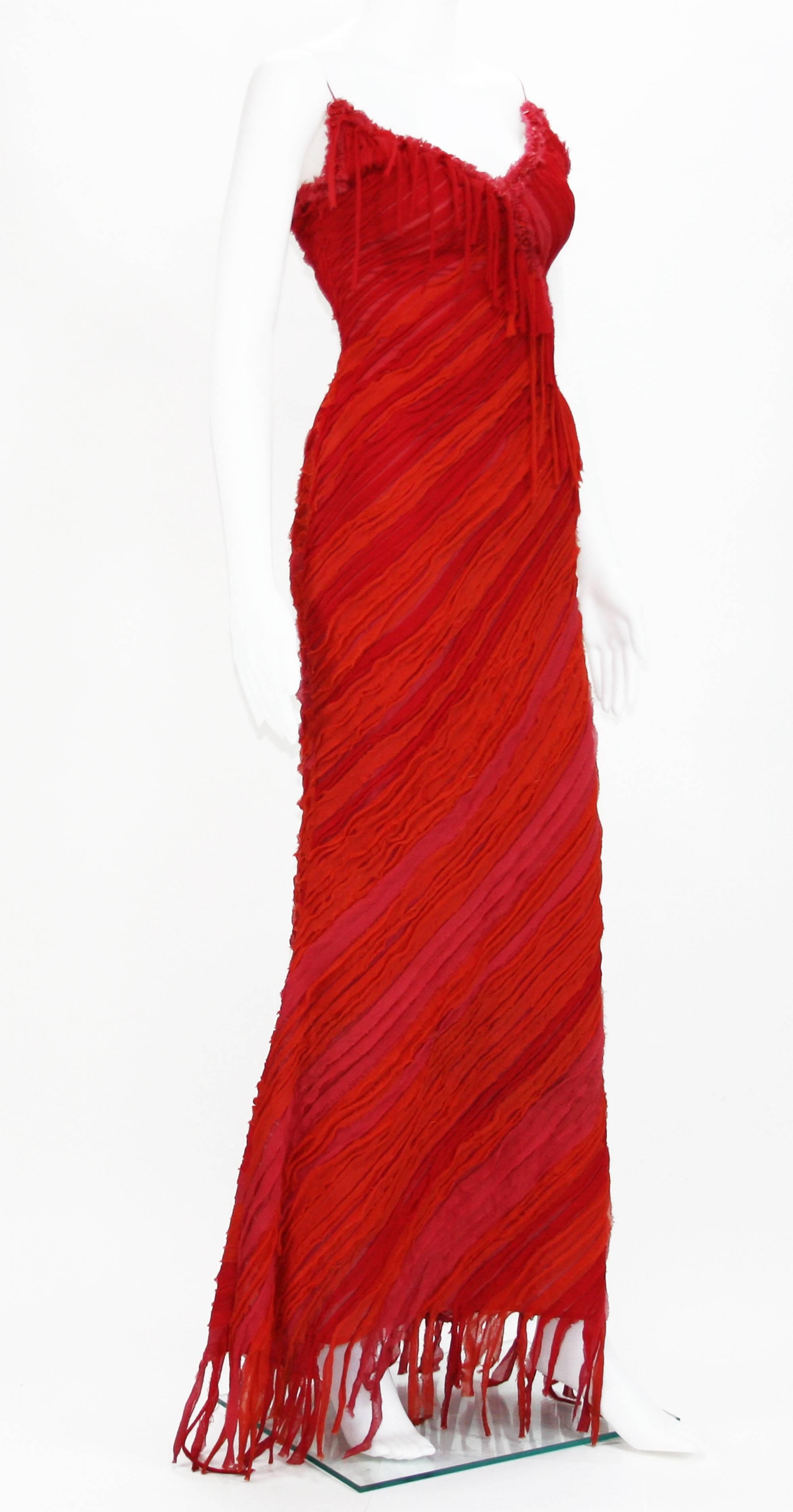 Naeem Khan Red Embellished Long Dress 
100% Pure Silk
Size 6
Colors - Red, Orange, Fuchsia., Distressed Look, Red Coral Embroidery, Back Zip Closure, Fully Lined.
Measurements: Length - 56 Inches + 5 inches fringe, Bust - 30 inches, Waist - 26
