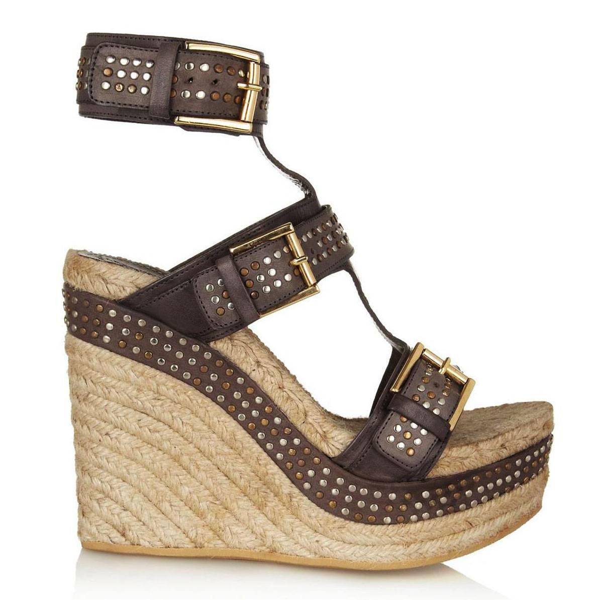 A Self-Assertive Twist on the Classic Gladiator Sandal, this Alexander McQueen Espadrille Wraps up your Ankle with Hardware-Laden Straps.

New Alexander McQueen Leather Studded Sandals.
Designer Size 39 C – US 9 C
Color – Brown.
Wide Calfskin Straps