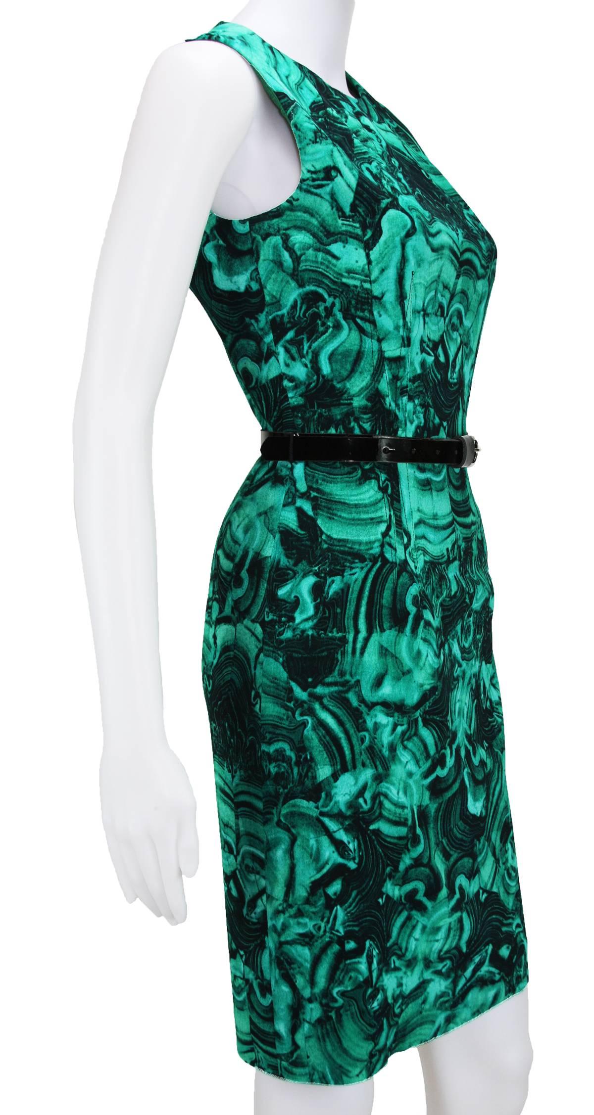 Created from the Fabric of TONY DUQUETTE'S Iconic Malachite Pattern.
2009 Collection
Size - 4
Color – Emerald Multi (Green, Black)
Sheath Silhouette
Belted Waist – Black Patent Leather with Silver Tone Buckle
Hidden Back Zip, Sleeveless
Straight