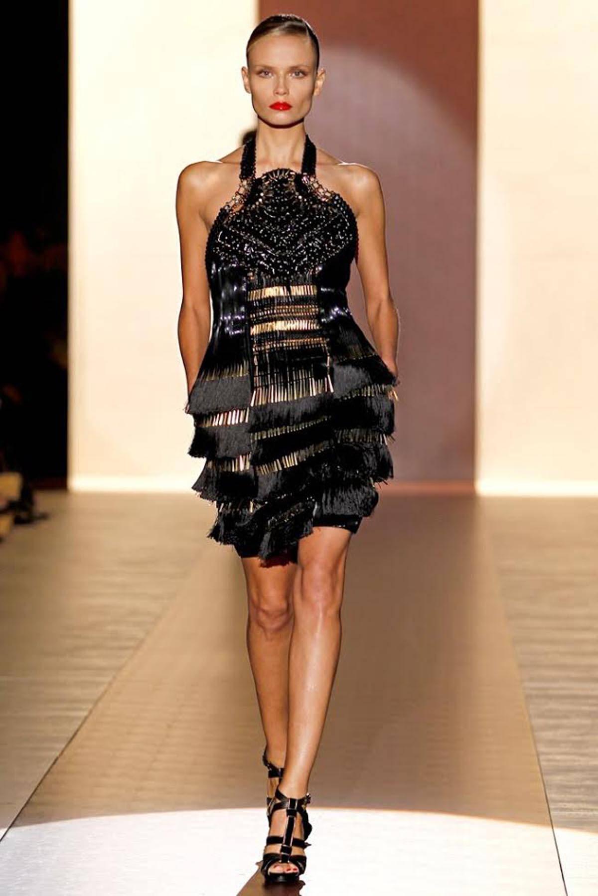 New GUCCI Fringe Fully Embellished Dress
Italian Size 40 - US 4
Halter Open Back Style Black Cocktail Dress
Black Silk and Metal Gold-Tone Fringes
Fully Embellished with Gold Tone Metal, Glass Beads, Patent Leather
Fully Lined, Back Zip Closure
Two