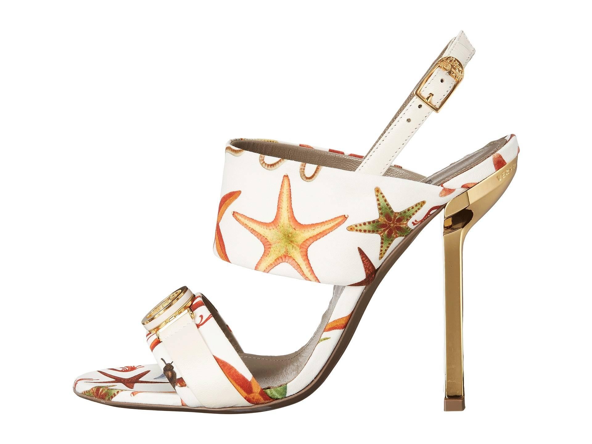 Be a gorgeous sea fairing maiden wearing the Versace Collection Oro Bizantino Printed Open Toe Heel.
Italian size 36 - US 6
Leather and textile upper.
Open toe silhouette.
Slip-on construction with adjustable ankle strap and buckle closure.
Leather