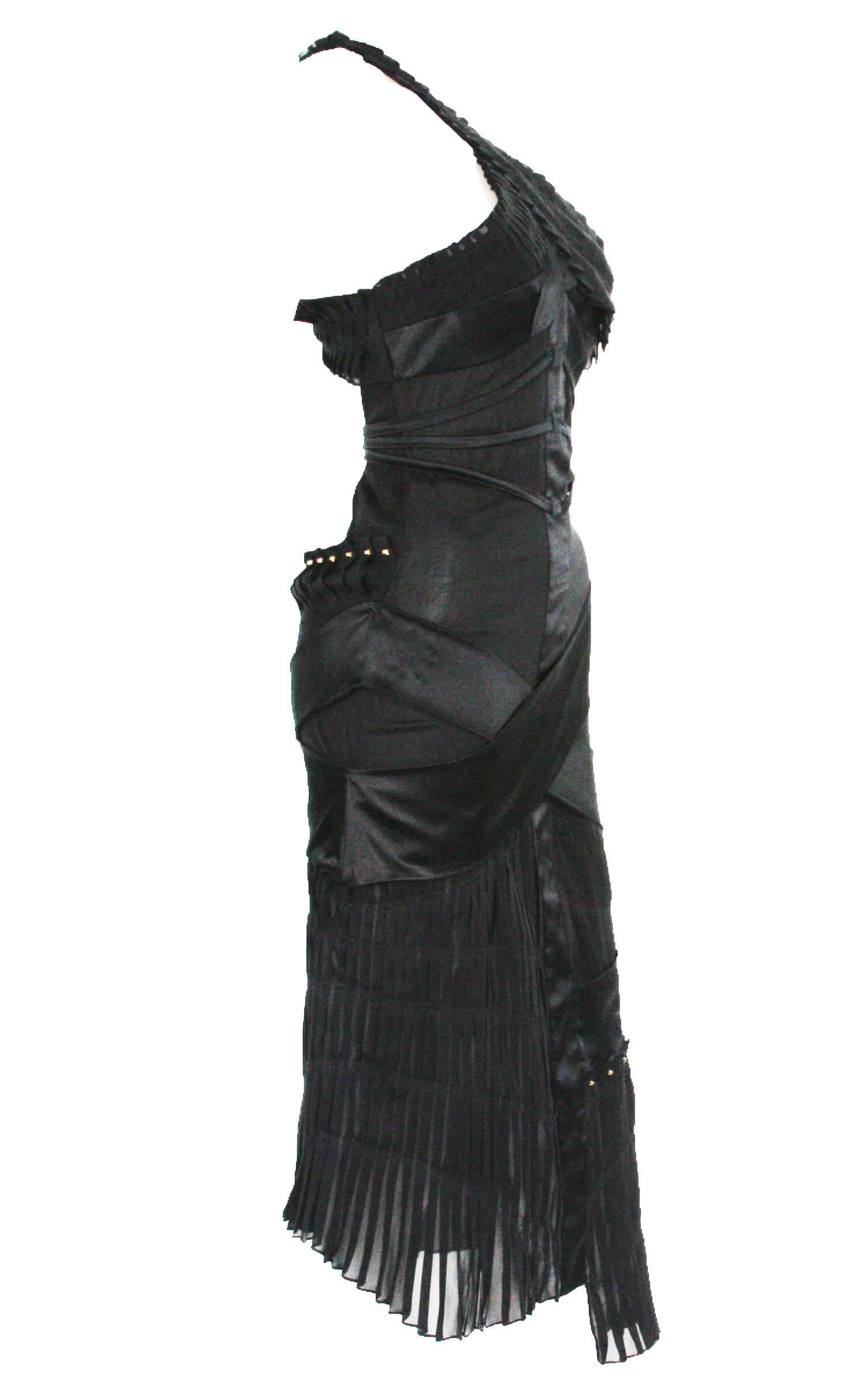 Rare Tom Ford for Gucci Rare Cut Out Studded Cocktail Dress
Italian Size 42 - US 6
2003 Collection
Super Sexy Black Studded Open Back Stretch Dress
Gold Tone Metal Hardware
Side Zipper Closure
Semi Sheer Fabric with Satin Details
84% Silk, 16%