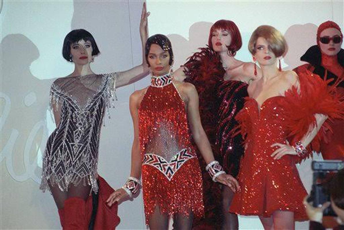 Bob Mackie F/W 1991 Nude Mini Fully Beaded Dress
From the second picture - Models wear the fashions of designer Bob Mackie at his Fall 1991 show in New York, April 11, 1991. The clothing is inspired by the music of Cole Porter.
Same dress in black