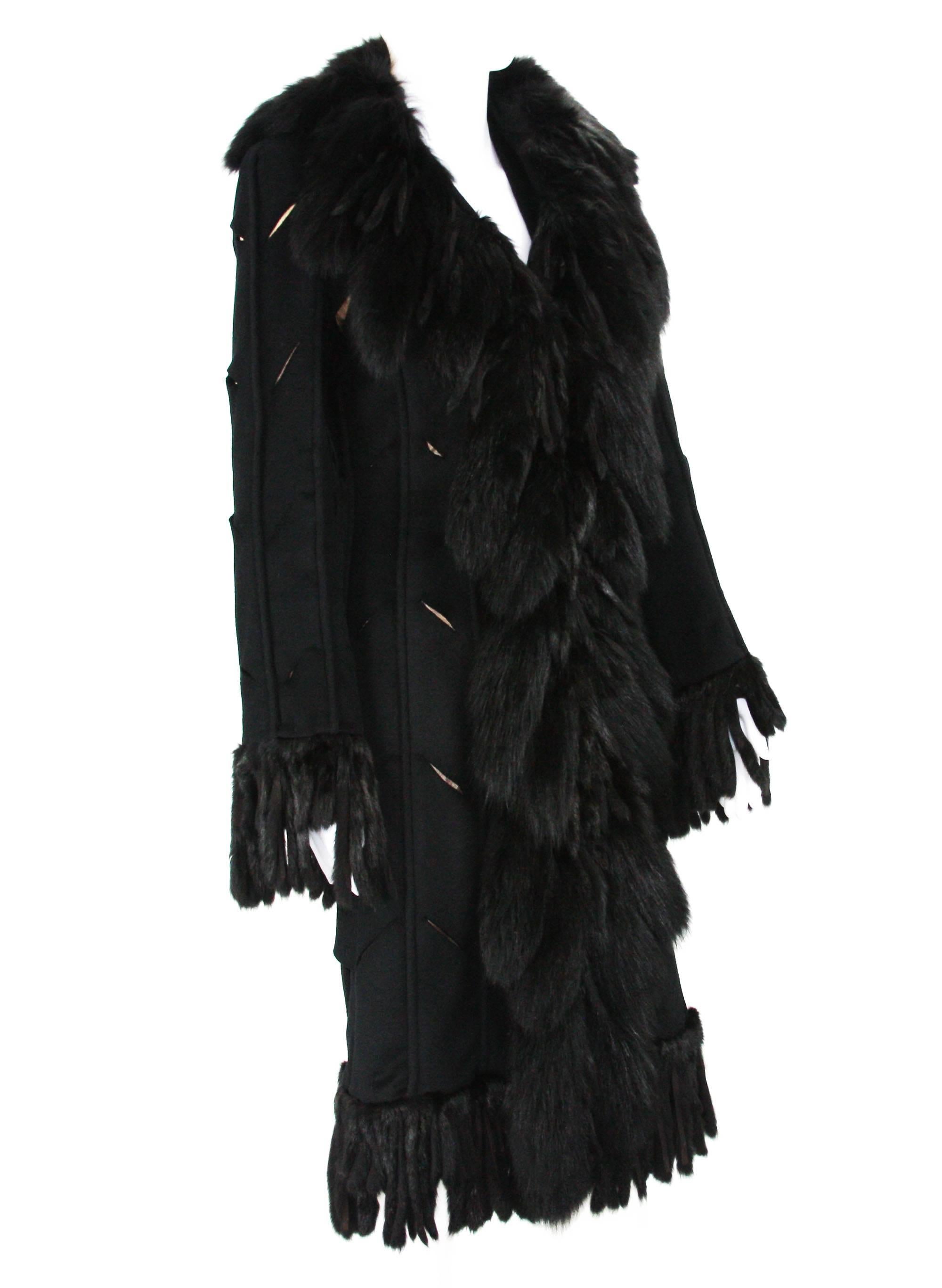 Very Unique Versace Fox Embellished Black Coat
Italian size 38
Multiple sizes Fox Fringes, Cut Out Details with Beige Background Around Entire Coat, Hook and Eye Closure, Fully Lined in Black Versace Logo Lining.
46% Angora, 34% Wool, 12% Fox, 8%