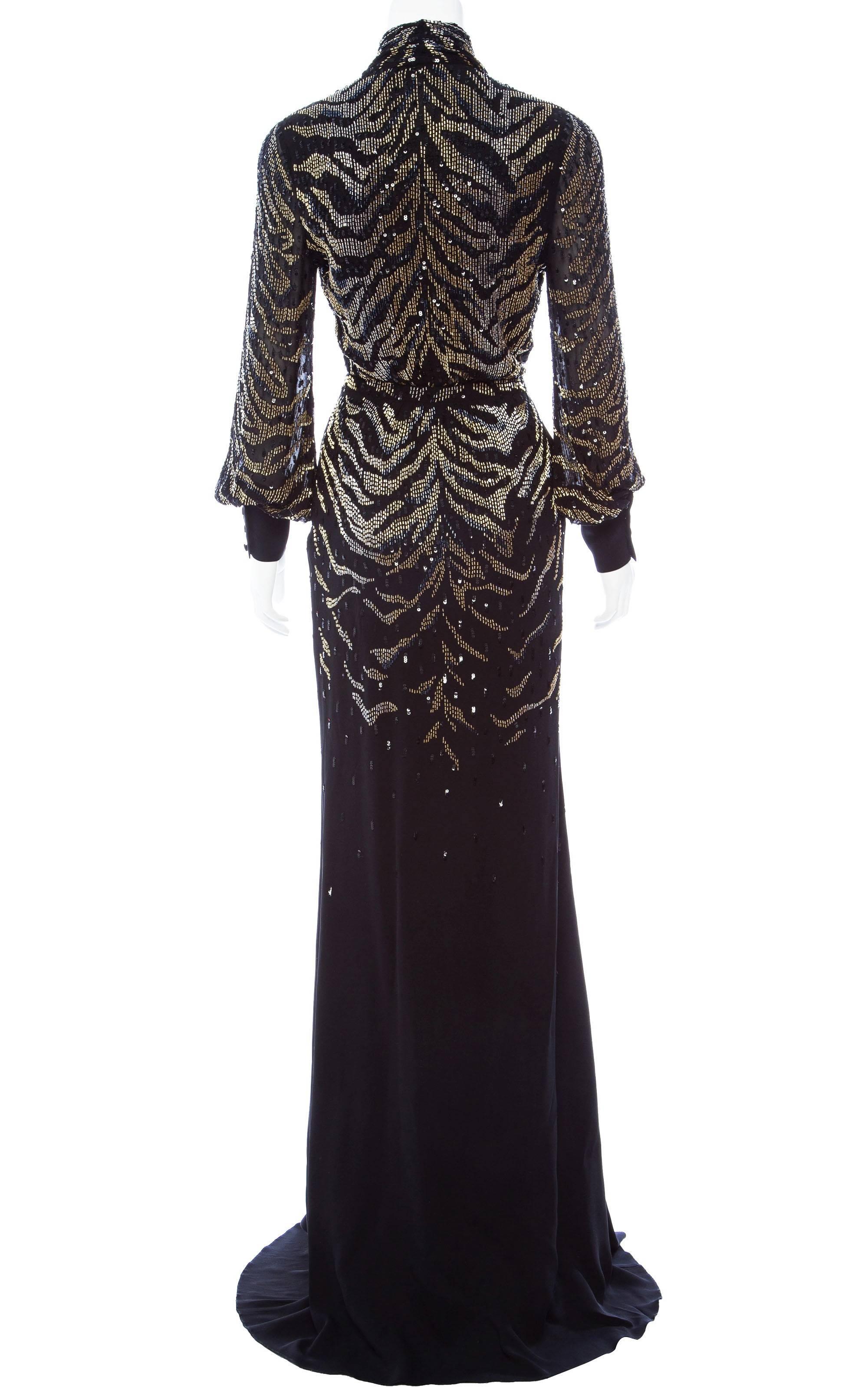 Roberto Cavalli Silk Embellished Kimono Dress. Italian size 38. Tiger pattern dazzling black dress with golden and metallic handcrafted beads. Classy and chic, this Kimono style design is presented with a high leg slit at the front for a dangerous