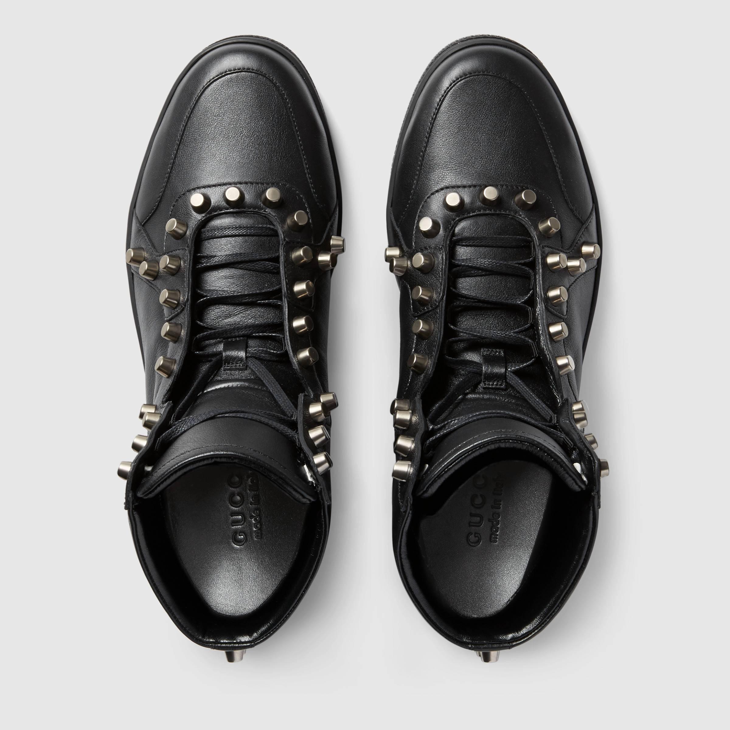 New Gucci Men's Leather Black High-Top Sneakers with Studs
Designer sizes available 7 and 8 / US sizes according to Gucci size guide 8 and 9 ( Italian sizes 41.5 and 42.5 )
Miro soft black leather, Silver-tone metal studs hardware details, Signature