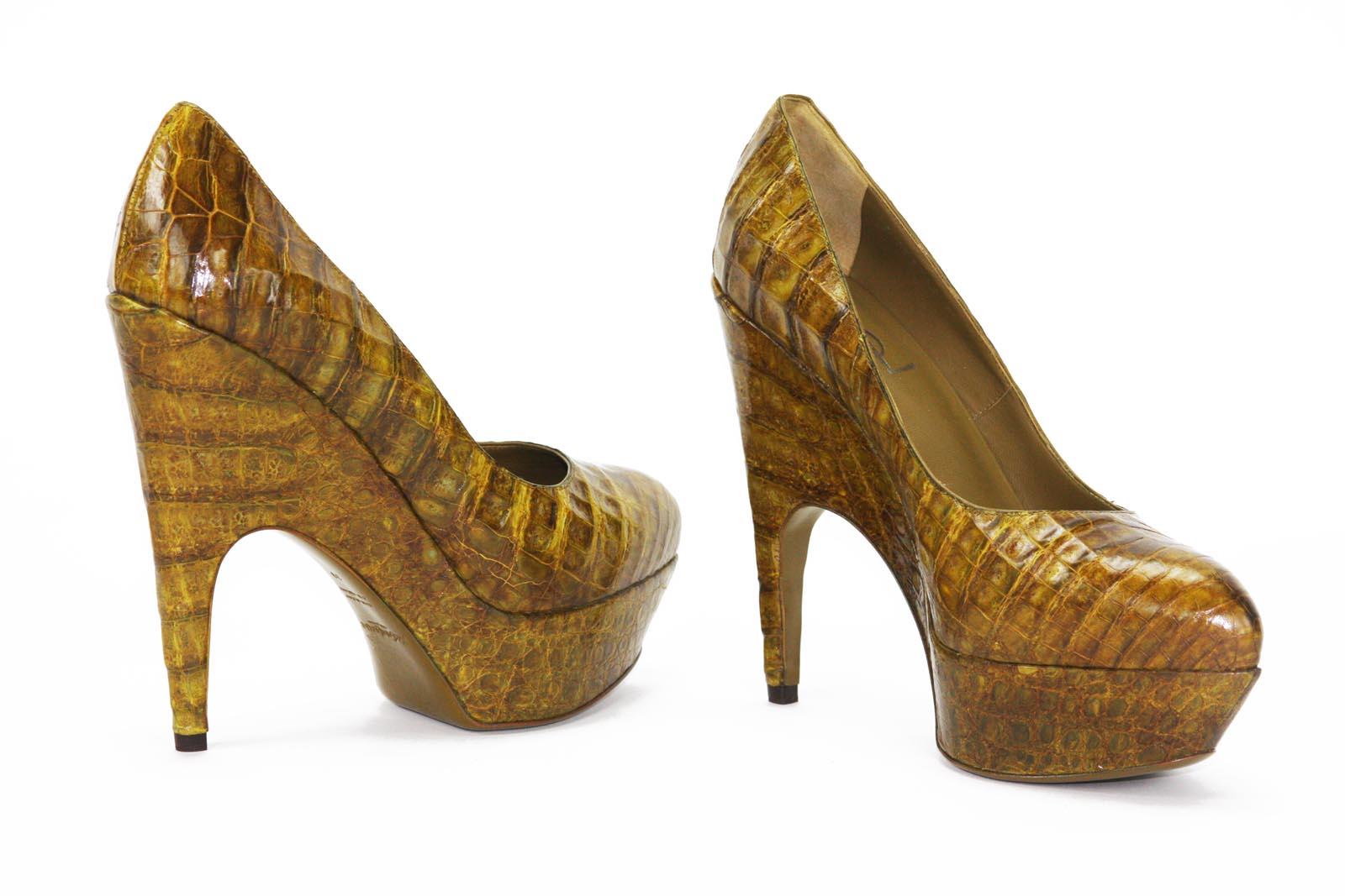 New Yves Saint Laurent Genuine Alligator Platform Shoes
Designer size 39 - US 9
Mix of colors - Brown, Yellow, Green.
Platform Height - 1.5 inches
Heel Height - 5.5 inches
Padded Leather Insole, Leather Sole.
Made in Italy
New with box.

The mixture