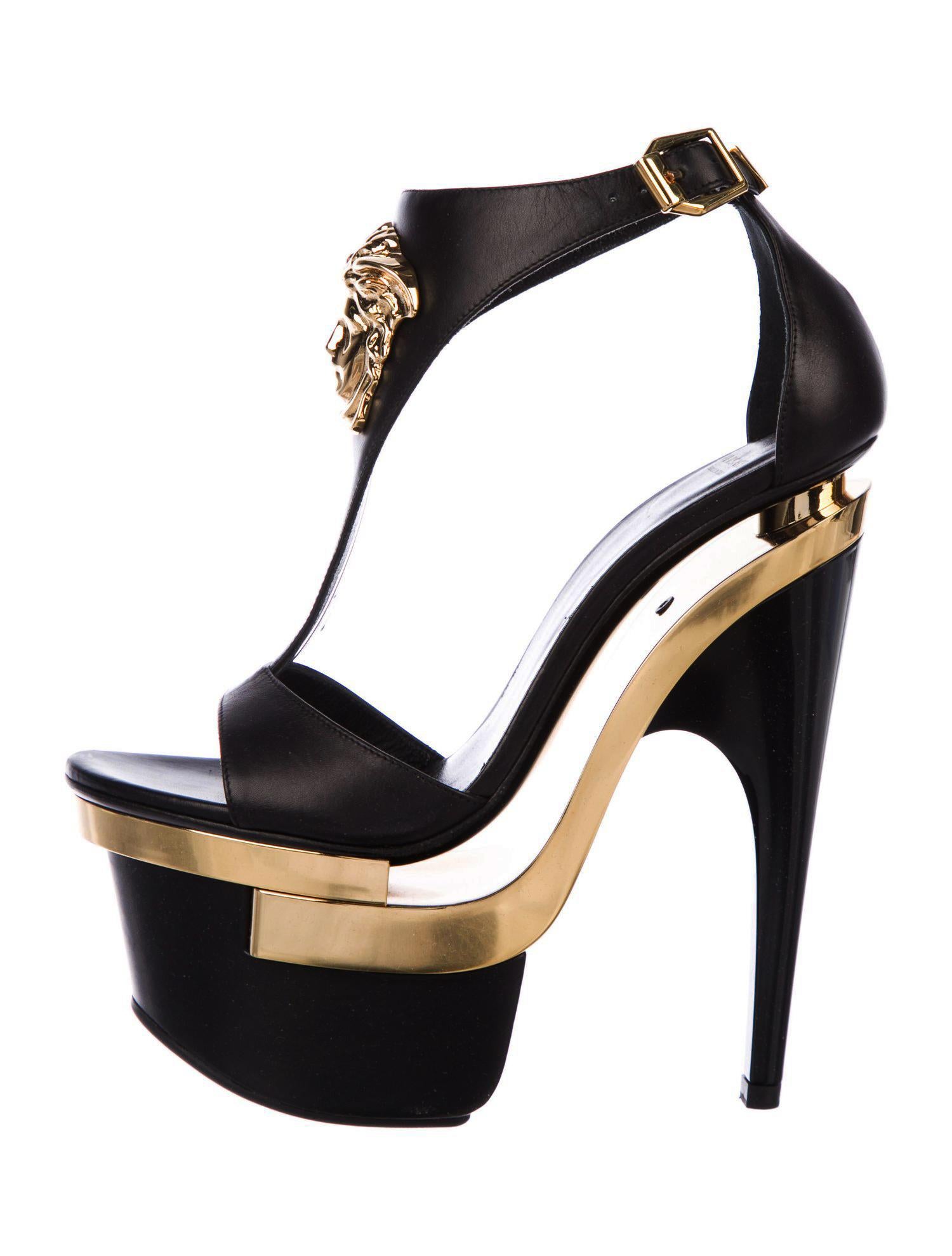 New Versace Black and Gold Leather Triple Platform Sandals
Designer size 35 - US 5
Sold out everywhere after they appeared in Nicki's video!
100% Leather, Gold-tone Medusa at Vamps, Triple Platform, Gold-tone Buckle Closure.
Heel Height - 6.5