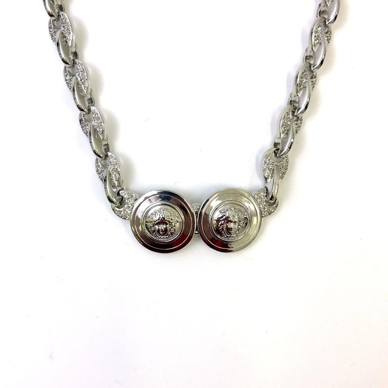 Gianni Versace silver double medusa head necklace with rhinestones