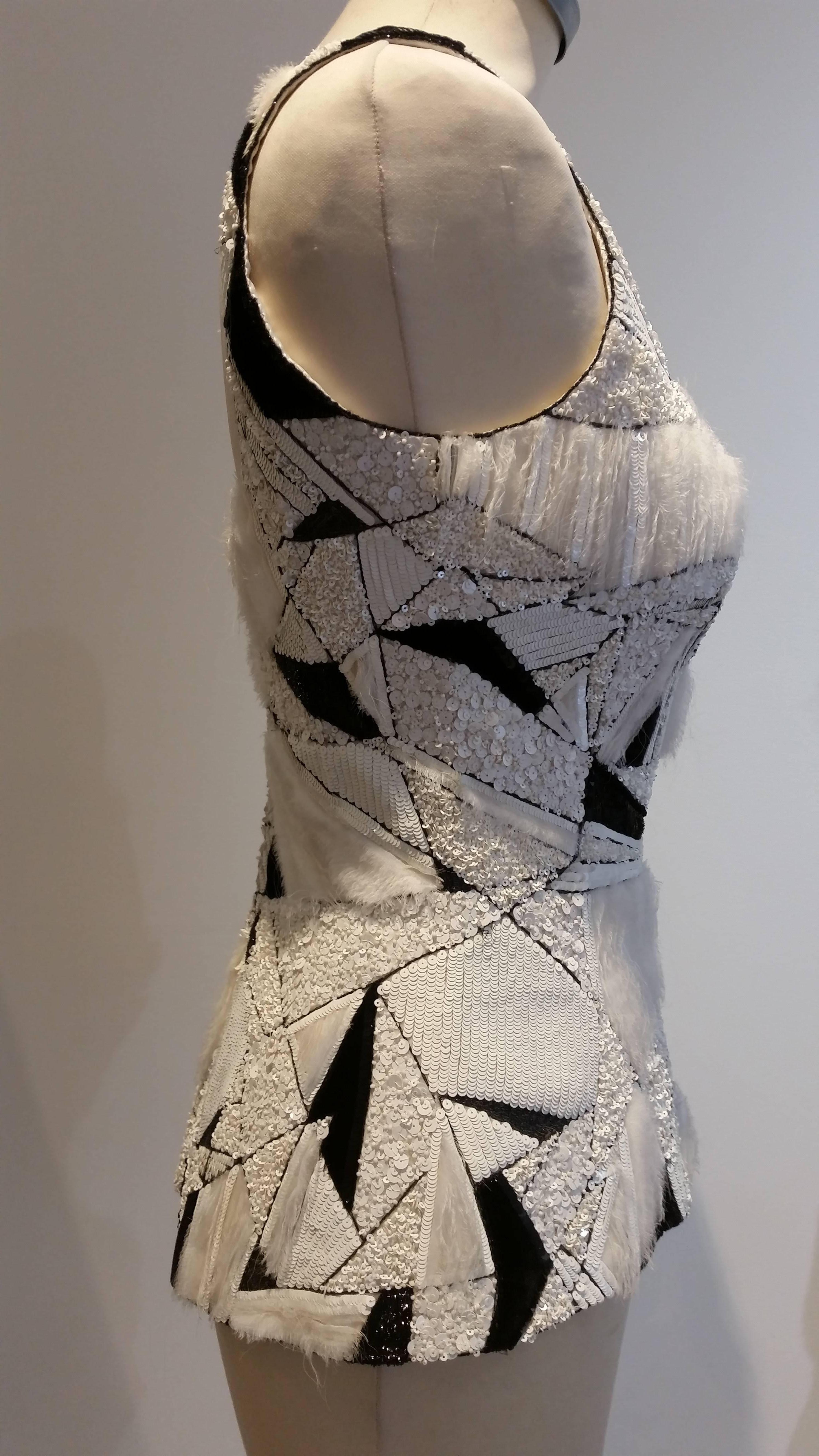 Chanel Haute Couture Bodice.
Black and white sequins interspersed with black silk and white raw edge white silk. A patchwork of various sized sequins.
Back zip.
Fully lined with white silk.
Extra support fastening.
Fits where it touches.
Please see