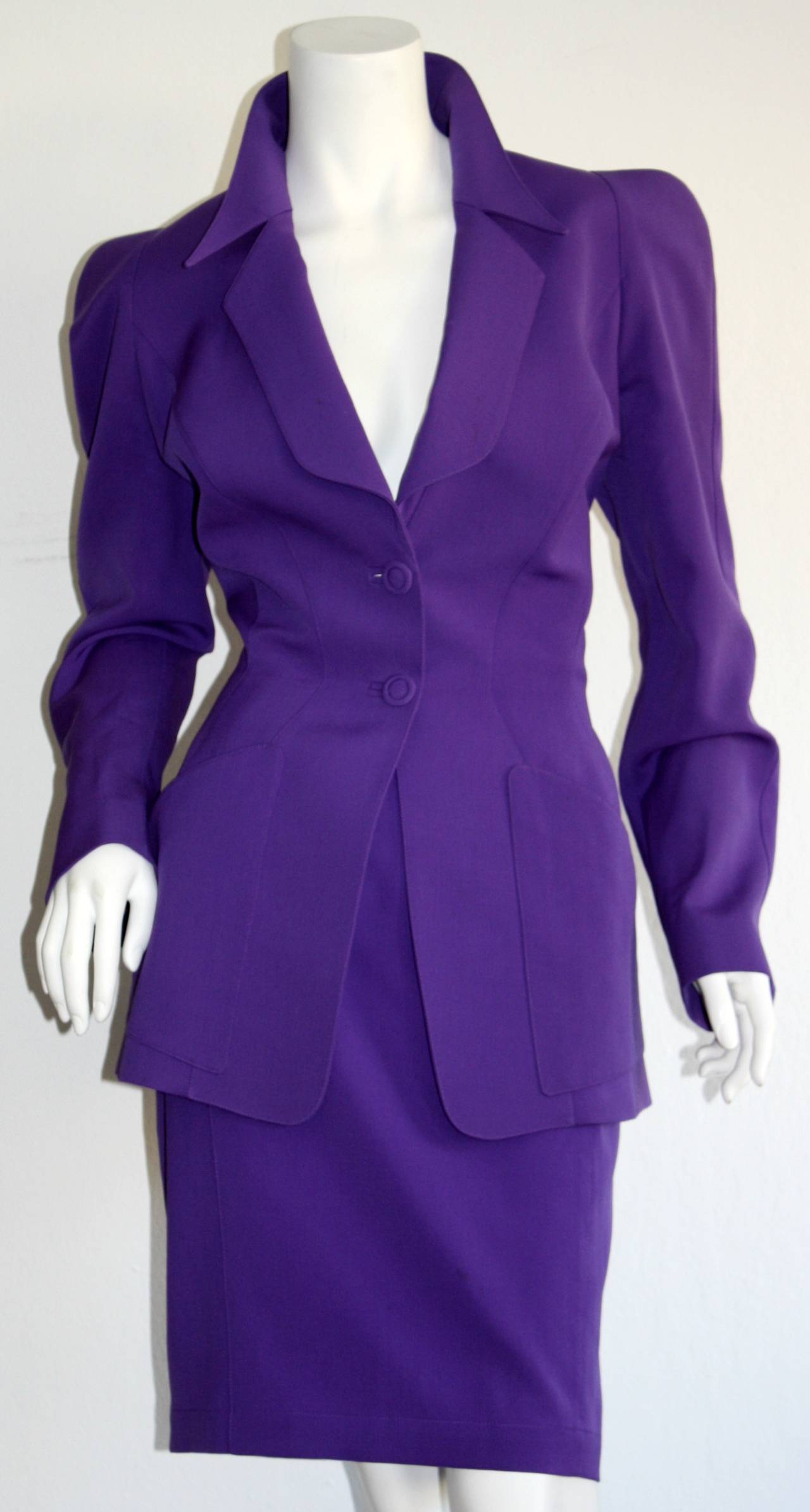 Stunning vintage Thierry Mugler vibrant purple skirt suit! Signature Mugler lapels, with a figure flattering high waist pencil skirt. Perfect for the office, or for an event. Both pieces also work fantastic as separates! Fully lined. In great