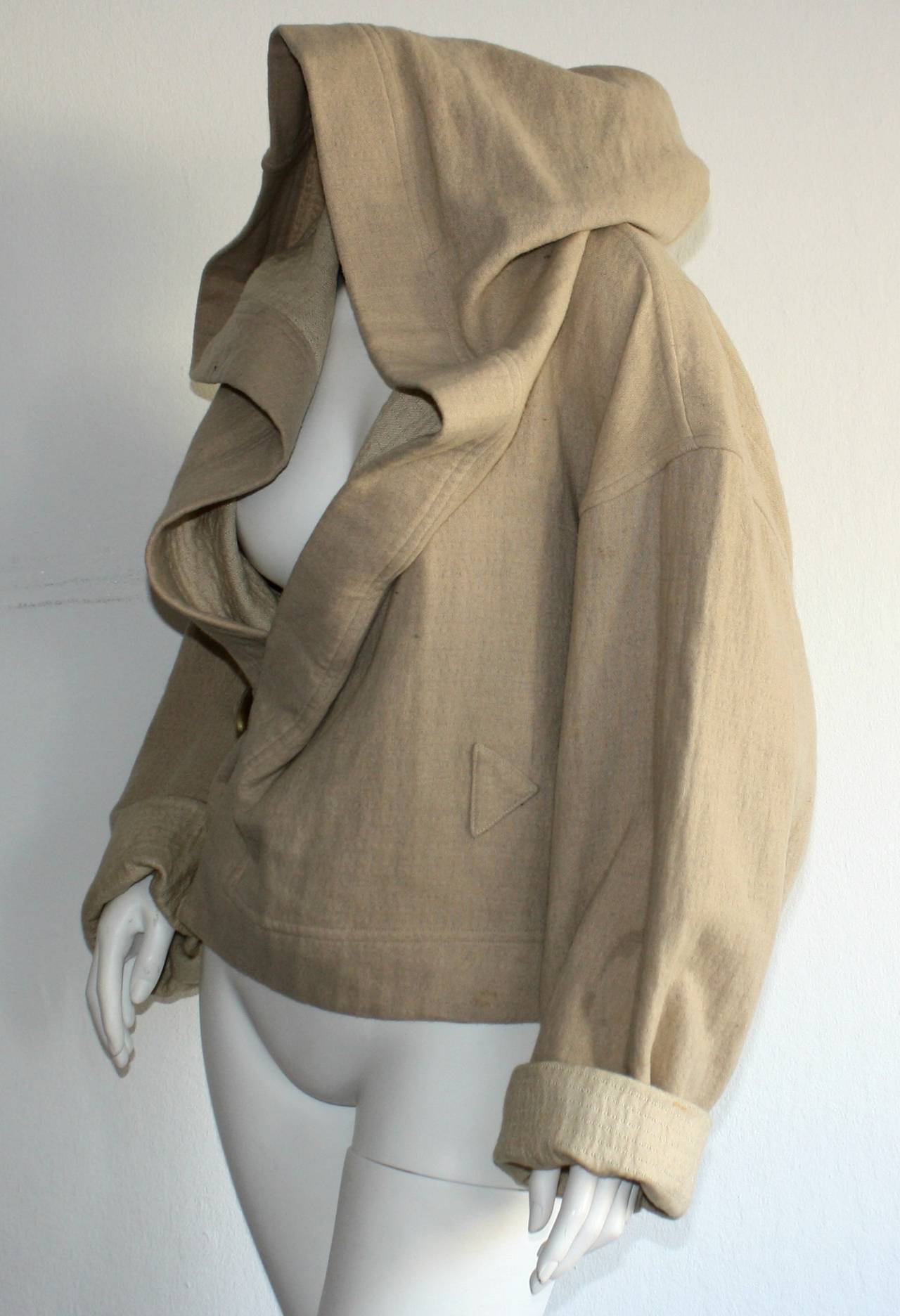 Incredible vintage Plantation, by Issey Miyake khaki colored slouchy jacket!!! Complete with horn toggle closure, and hood. Made in Japan.  In great condition. Fully lined. Marked size small, but, will fit most sizes.