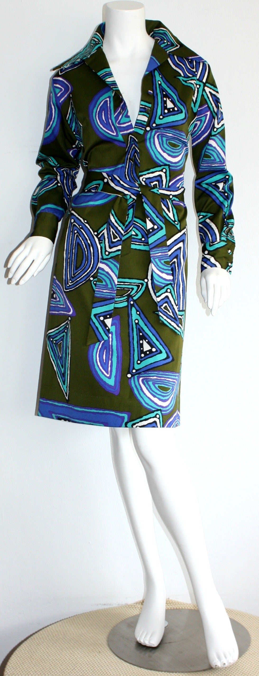 Beautiful vintage Lanvin shirt dress, with detachable tie belt! Vivid green color, with various hues of blue op-art geometric prints throughout. Buttons up the bodice, and at cuffs. Can be worn a number of ways, casual or dressy. Looks great with