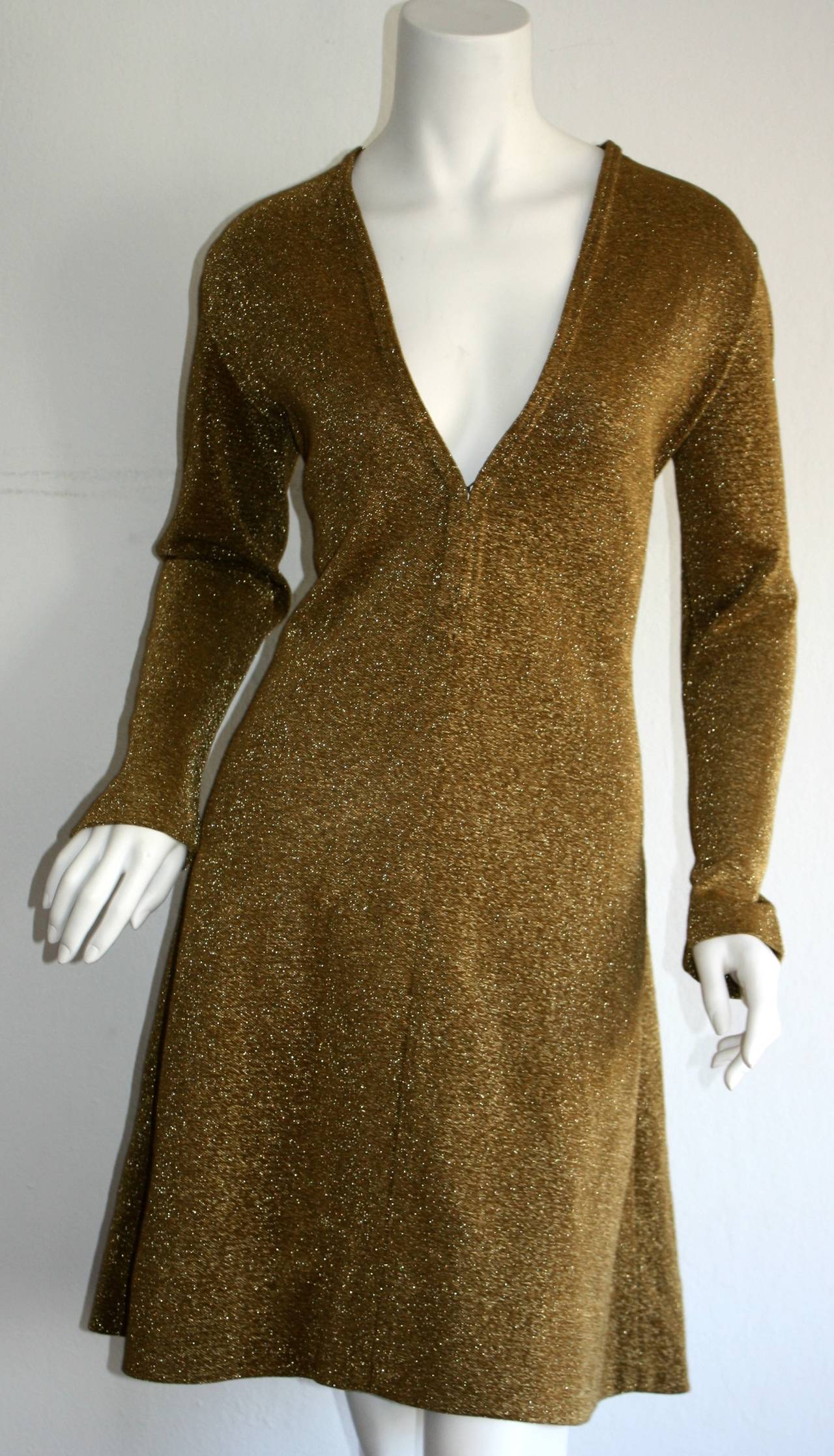 Super rare 1960s Rudi Gernreich for Harmon Knits gold knit dress! Sexy plunge bust, that features hidden hook-and-eyes to control cleavage level. Perfect A-Line shape that is extra flattering. Can be worn for dress or play. Looks great for a