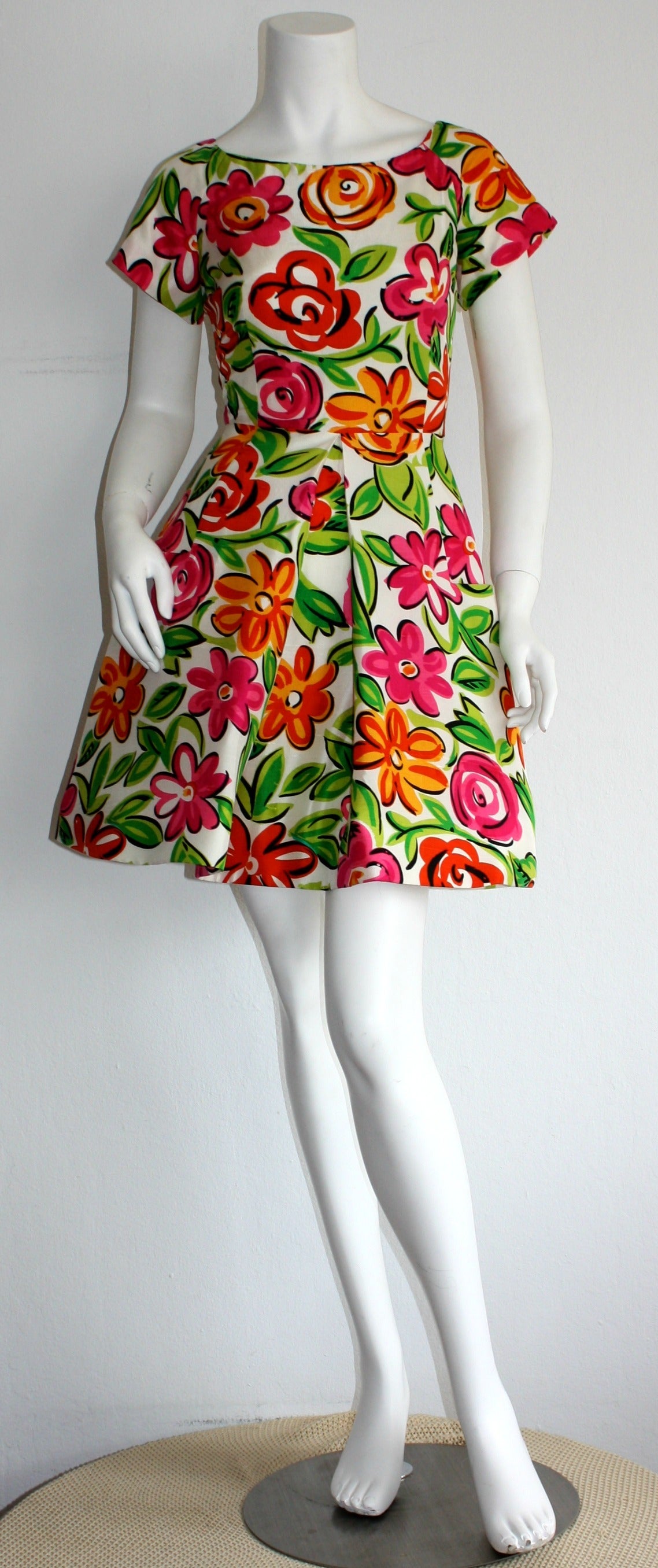 Adorable vintage Scaasi 1990s dress! Chic all-over floral print in vibrant hues of pink, orange, green and white. Wonderful high-quality silk. 'Pouf skirt' features braided horsehair inside hem for an extra flared skirt. Chic oversized pockets on