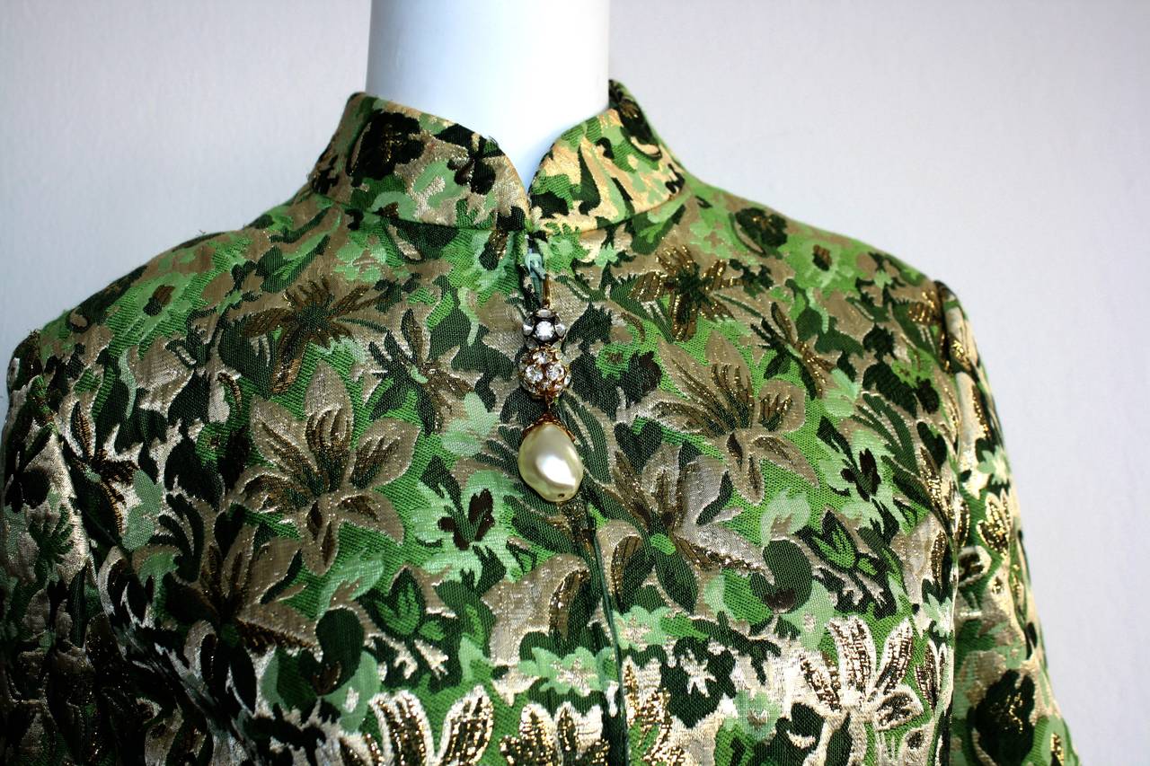 Wonderful vintage Ceil Chapman Dress and pants ensemble! Owned by British Royalty. Beautiful green and gold brocade, with stunning oversized pearl and rhinestone zipper detail up bodice. Dress has a flattering A-Line fit. Pants feature flared leg,