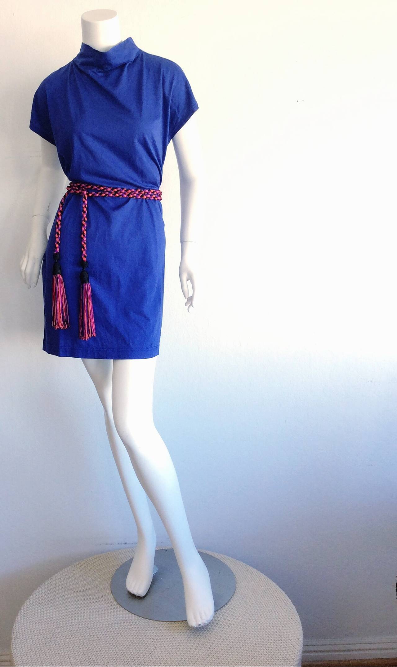 Everything! An open canvas!!! This 100% cotton dress features a 'smock, neck, and be worn a number of ways, day to night. Pictured YSL tassel belt is perfect with this piece is also available in my 1stDibs Shop. Marked Size Small, but fits Medium,