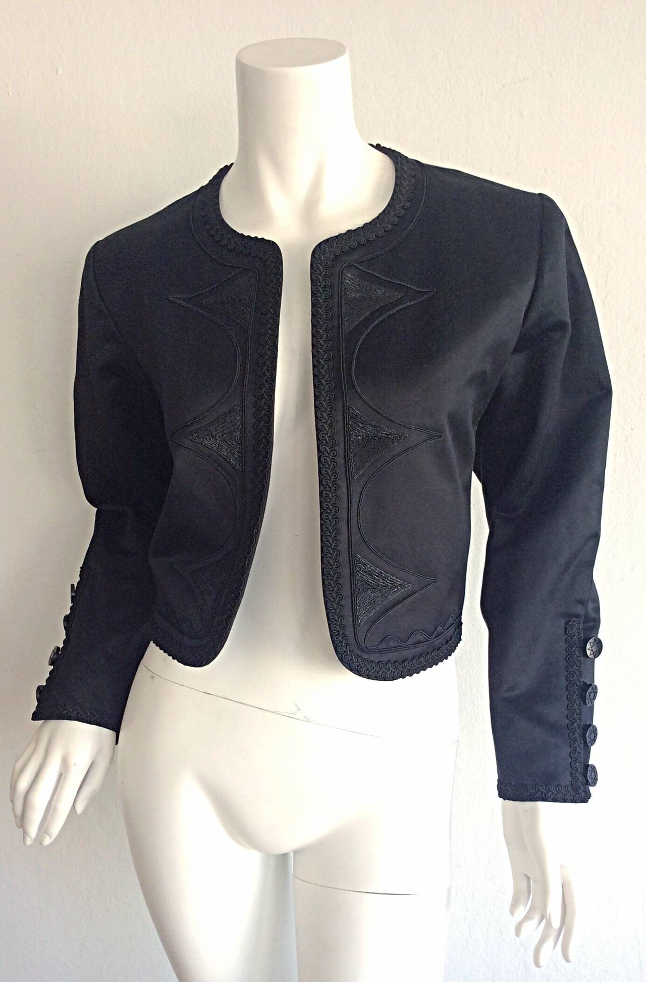 Beautiful vintage 1990s YSL cropped black jacket! Wonderful attention to detail, with intricate embroidery down bodice, on bust, and at cuffs. Functional buttons at cuffs. The perfect go-to! Looks great with jeans, or over a dress. Made in France.