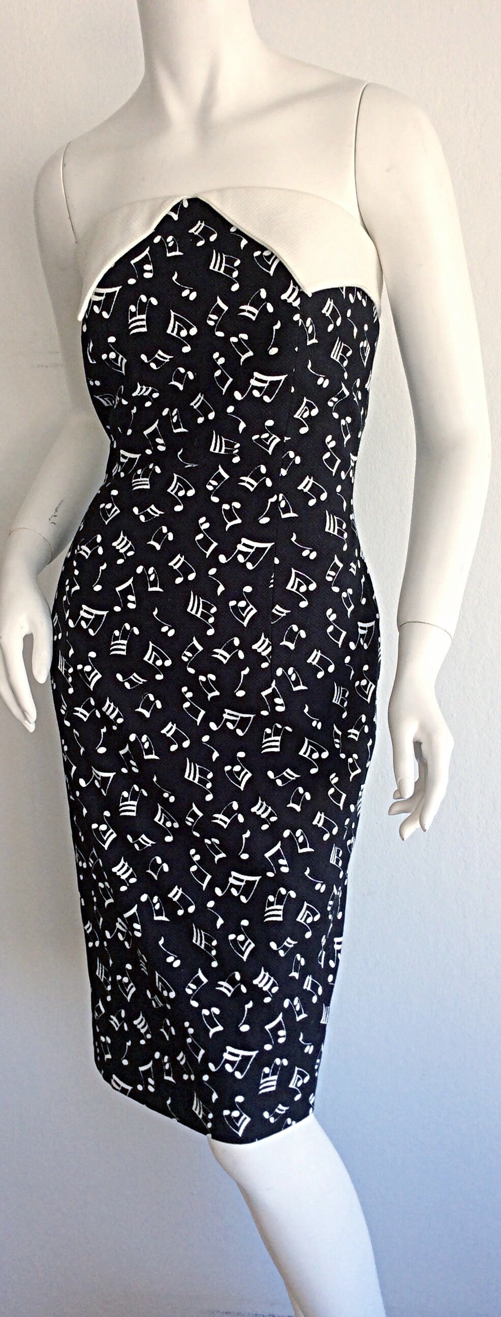 Iconic vintage Patrick Kelly music note dress! Features textured cotton, with matching white collar at bust. A legendary design, by a legendary designer. Fully lined. In great condition. Marked size US 10. Made in France.

Measurements:
18 inches