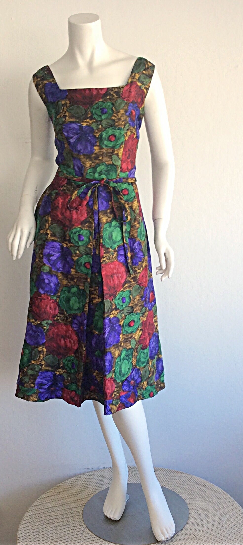 Simply divine vintage 1950s Adele Ross watercolor dress! Features the finest silk fabric, with wonderful vibrant hues. Detachable ribbon belt. Can easily go from day to night. Zips up the back, with hook-and-eye closure at back neck. Fully lined. In