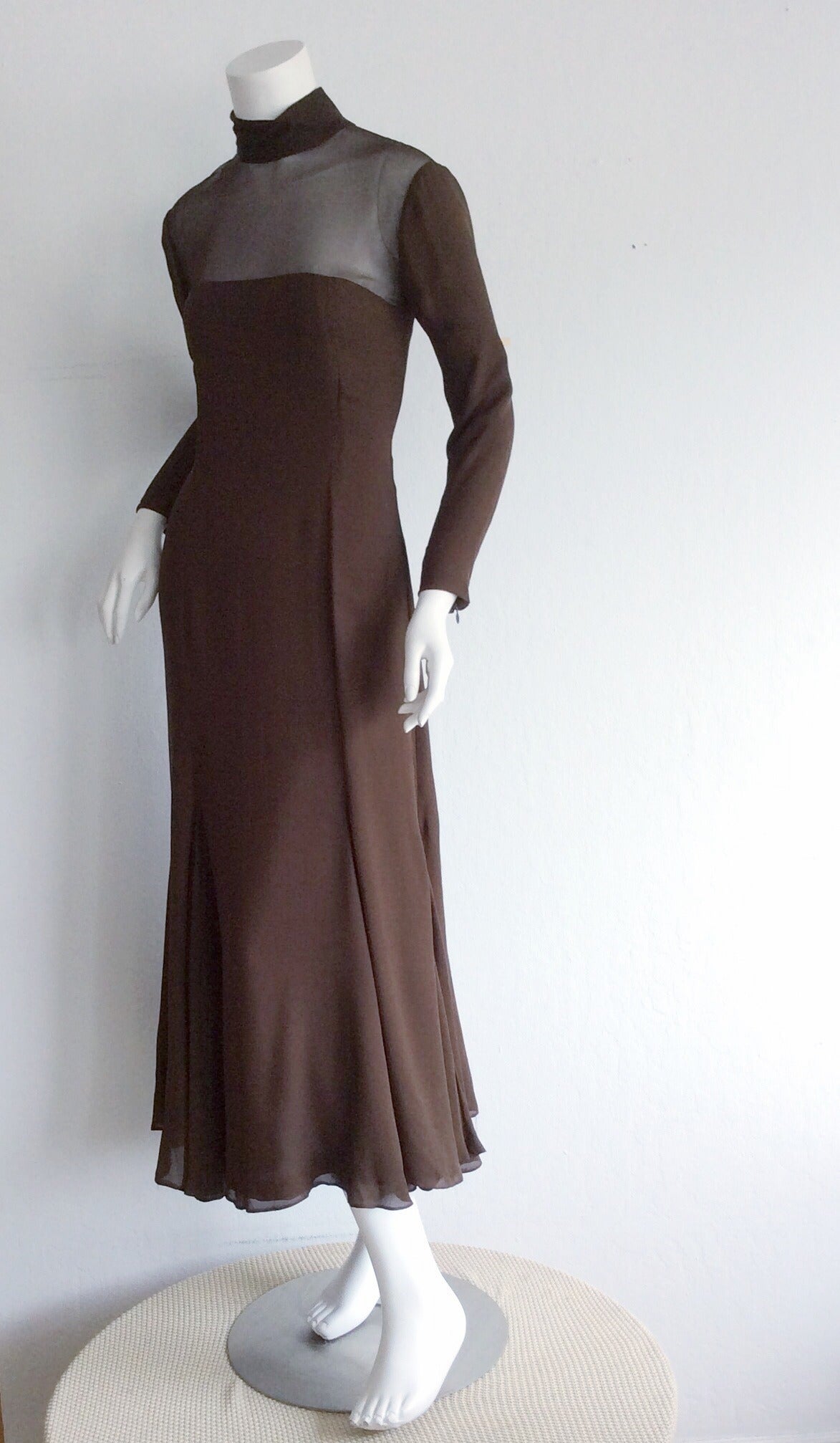 Exquisite vintage brown chiffon Nolan Miller Couture dress! Layers of wonderful chocolate brown chiffon, that look amazing with movement! Semi-sheer upper bodice, and arms, with a peek-a-boo in back. Perfect midi length! In great condition.