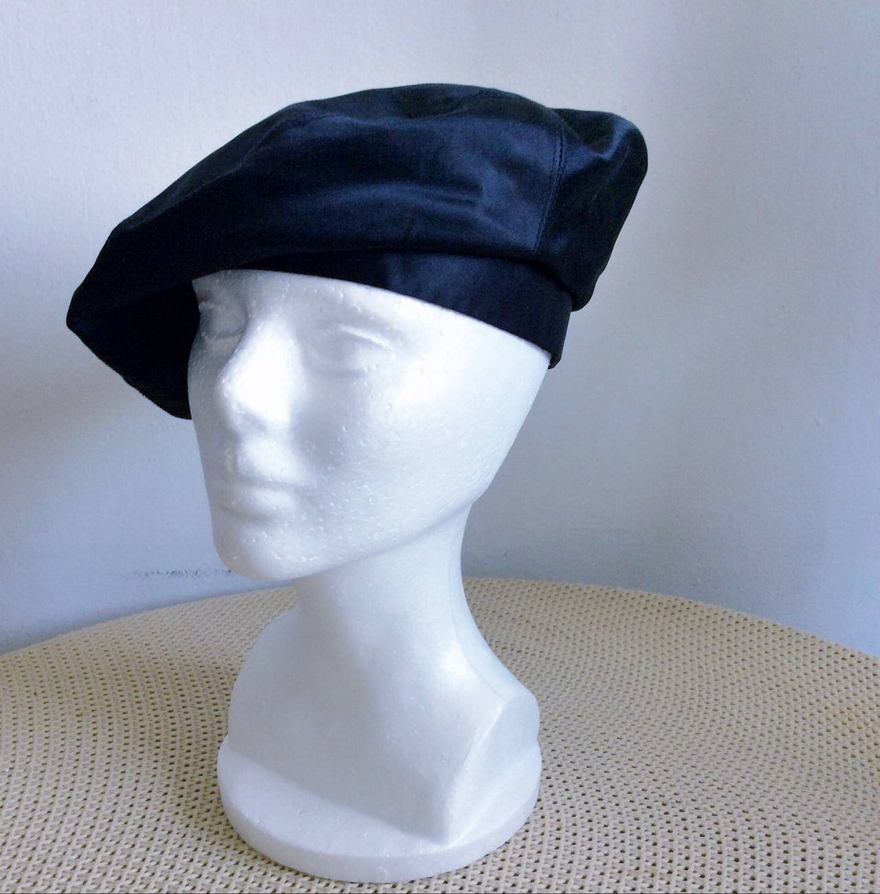 Wonderful black silk satin vintage Chanel beret! Extremely rare find, with so much style! Can easily transition from day to night. In great condition. Marked Size Medium