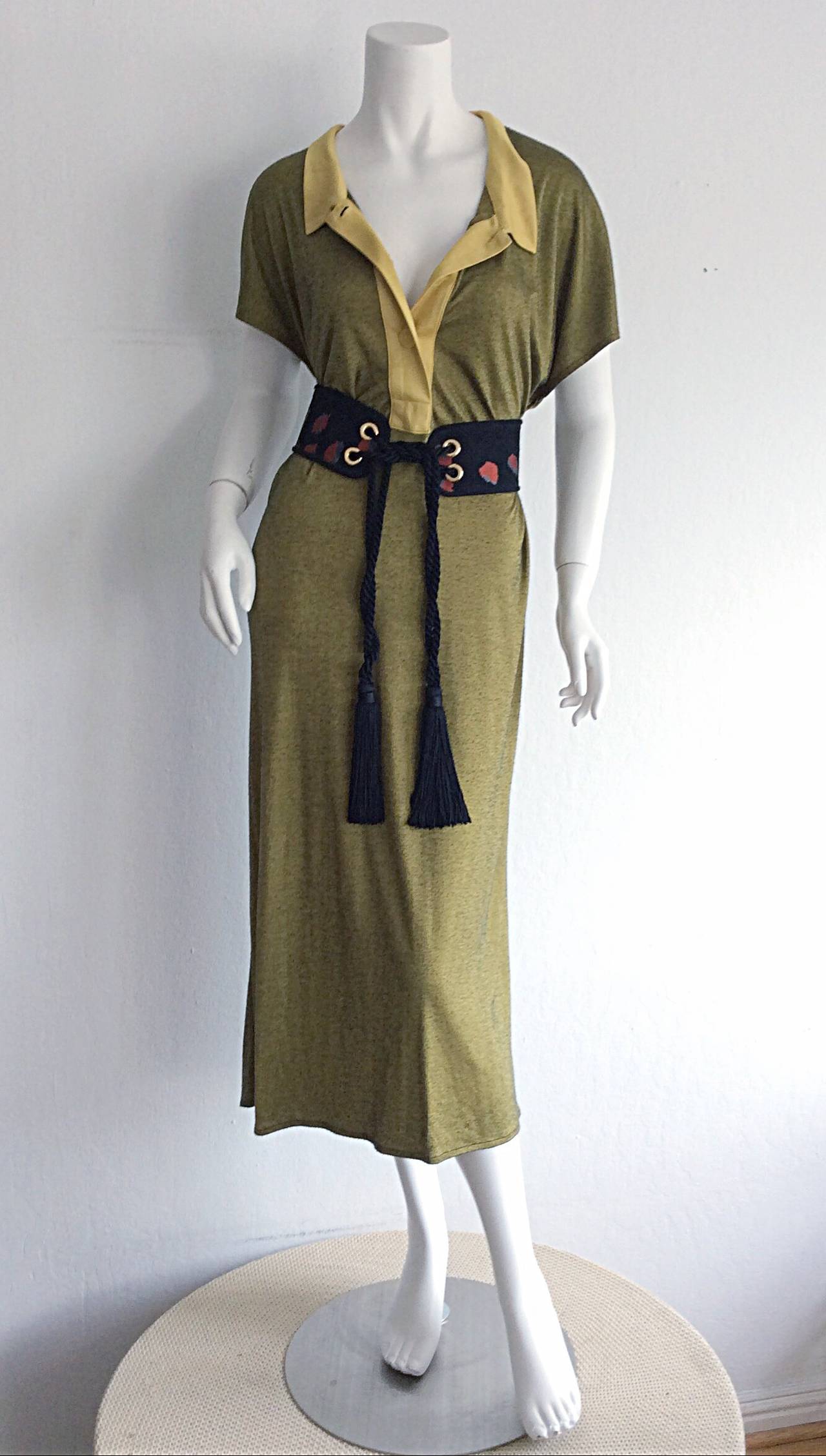 Extremely rare early 1960s YSL jersey dress! Features Peter Pan collar, with functional buttons up the bodice. Can be worn many different ways, and can easily be transitioned from day to night. Wonderful jersey material is flattering on all shapes! 