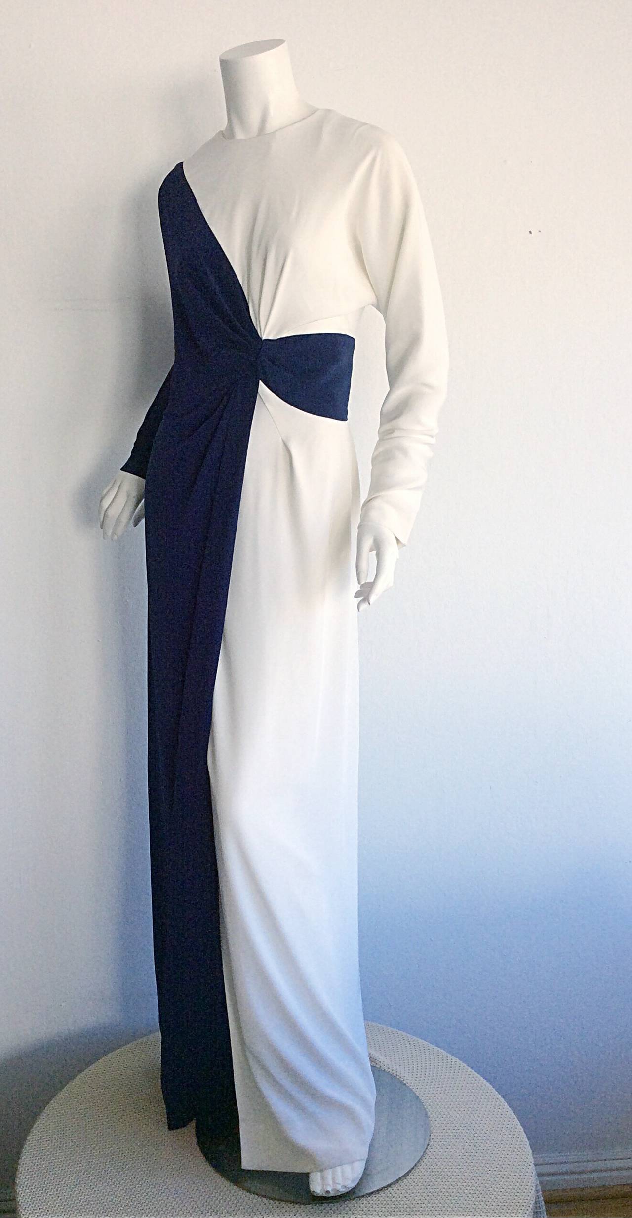 Beautiful, unique vintage Bob Mackie navy & white gown! Slight dolman sleeves. Wonderful lines make this a must have gown! Fully lined. In great condition. Approximately Size Small - Medium

Measurements:
Up to 44 inch bust (dolman sleeves)
30