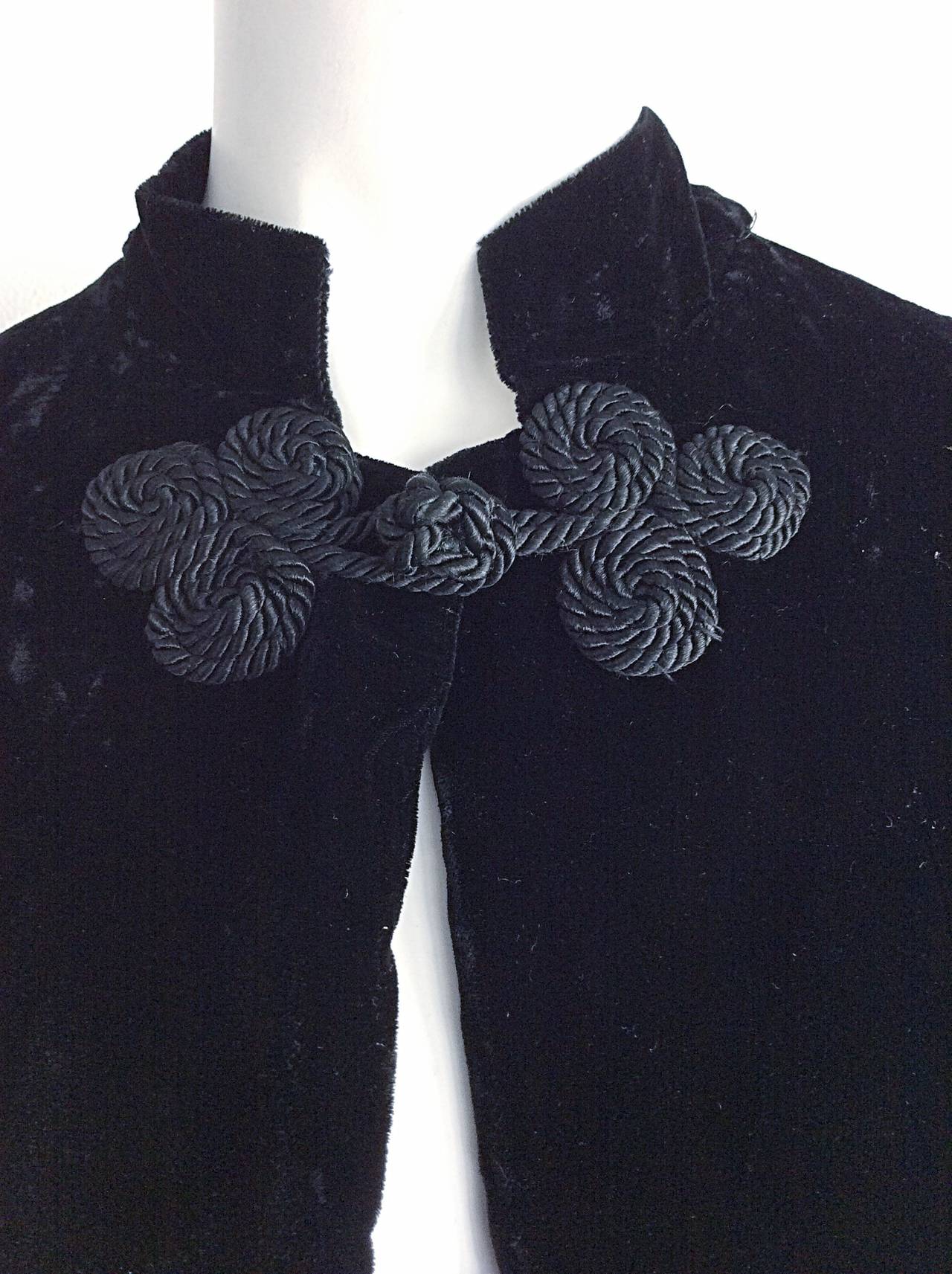 Incredible 1950s Ceil Chapman black velvet cloak! Lined with impossible to find milium fabric, which keeps the body extremely warm in even the coldest of climates! Intricate silk corded braided detail at neck closure. Attached weighted black velvet