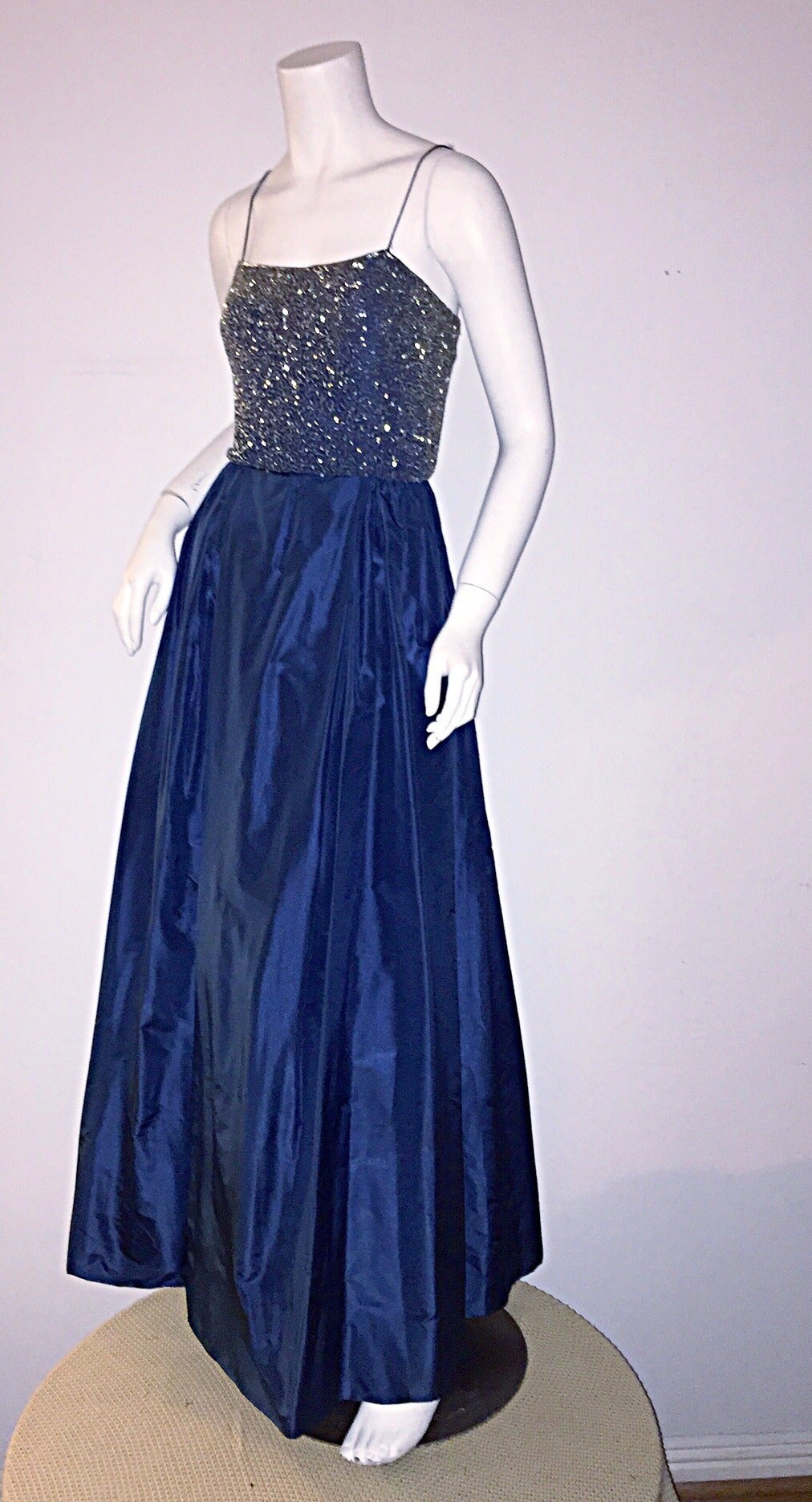 Drop dead gorgeous 1950s Saks Fifth Avenue gown! Stunning rich blue color, heavily beaded on front and back of bodice. Impeccable construction, with hand-finished details. Wonderful full taffeta skirt. A true statement dress, that is definitely a