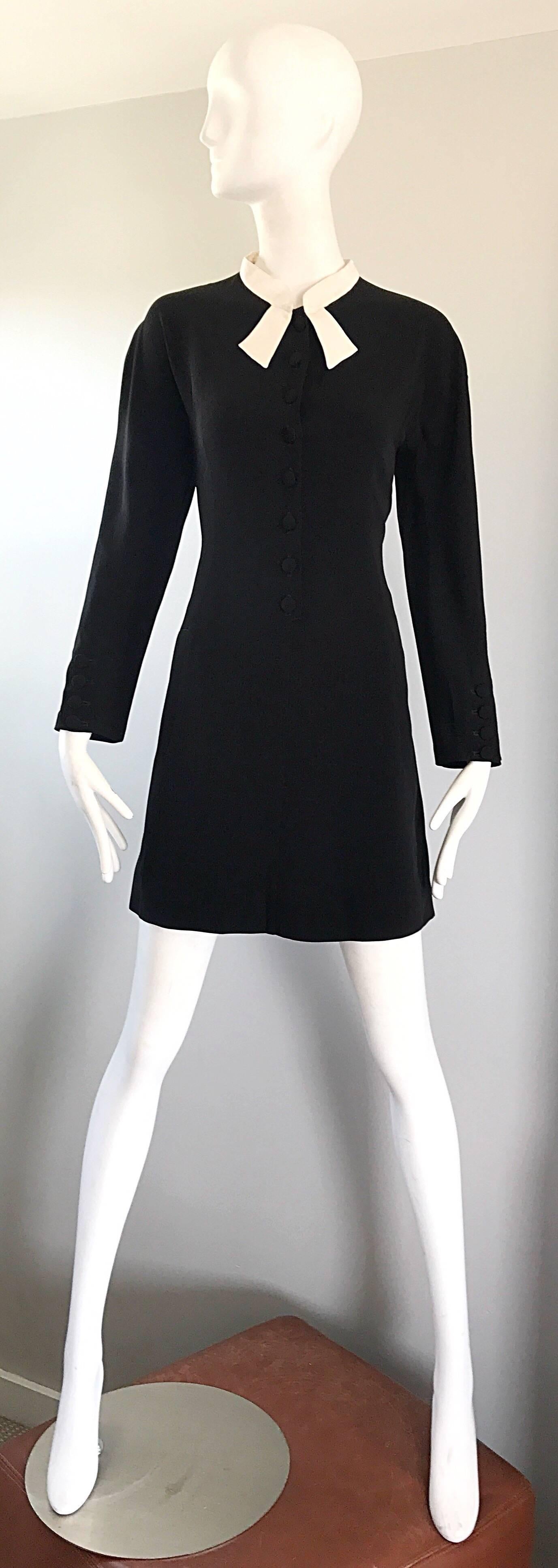 Lovely vintage KRIZIA black and white long sleeve 'tuxedo' dress! Features a tailored bodice with a loose fitting shift skirt. Attached white neck-tie detail. POCKETS at each side of the waist. Buttons up the front with hidden snap at top collar.