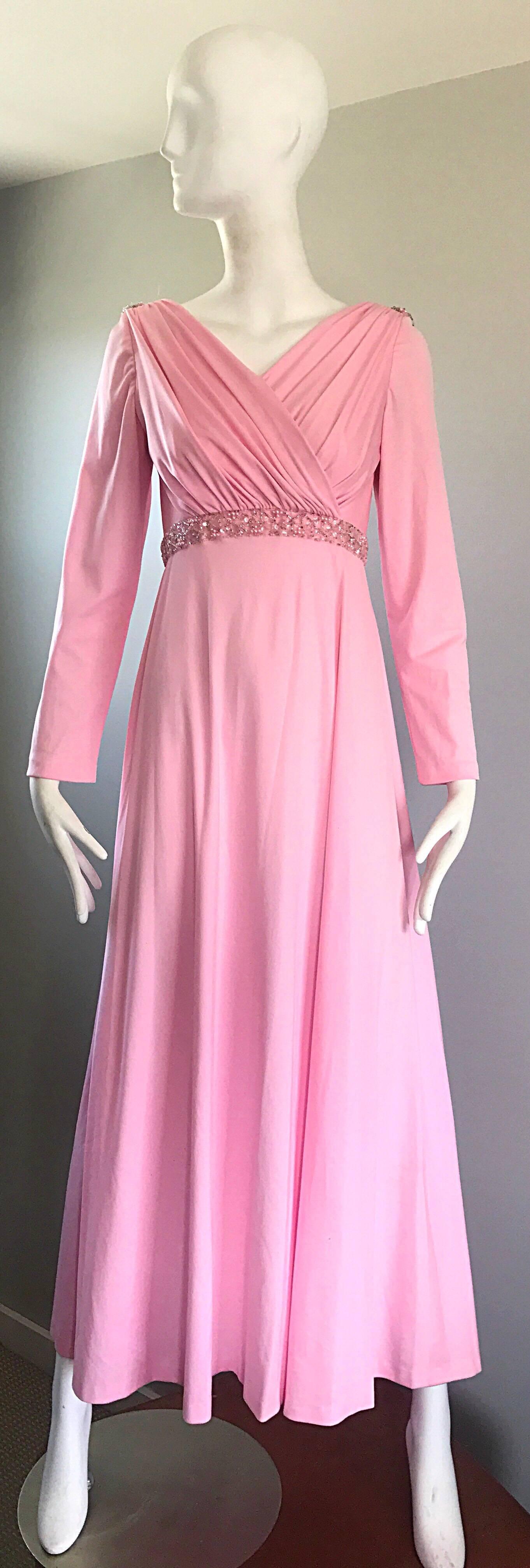 Amazing and gorgeous vintage 70s pale pink sequined and beaded long sleeve jersey gown / maxi dress! Features a pleated tailored bodice, encrusted with hand-sewn sequins and beads at the waist. Draped low cut back is also encrusted with hand-sewn