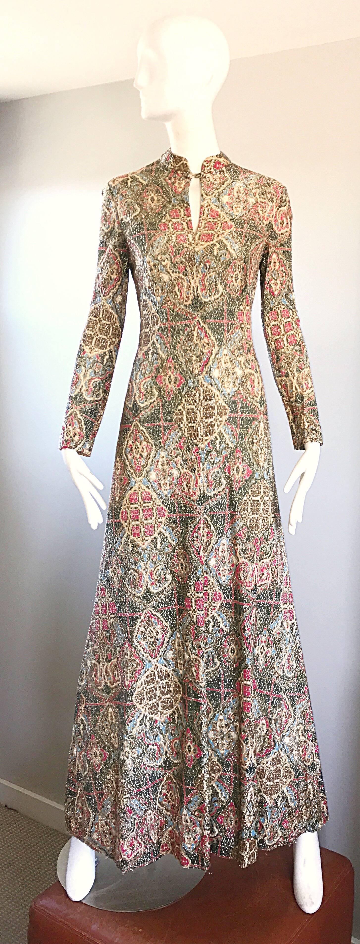 Incredible 1970s ADELE SIMPSON metallic lurex long sleeve Asian inspired gown / maxi dress! Features a unique chic Rococo Baroque / romantic batik ethnic print in warm hues of green, blue, red, brown, ivory and gold throughout. Gold lurex thread