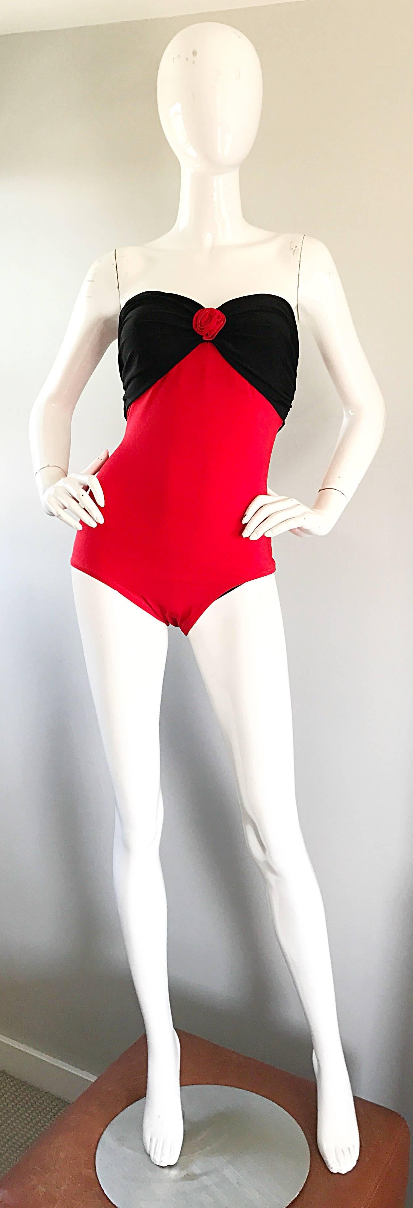Sexy vintage YVES SAINT LAURENT 1980s red and black color block heart motif one piece strapless swimsuit or bodysuit! Features a stretch to fit lipstick red body, with a black ruched bust that forms the shape of a heart. Simple step into this