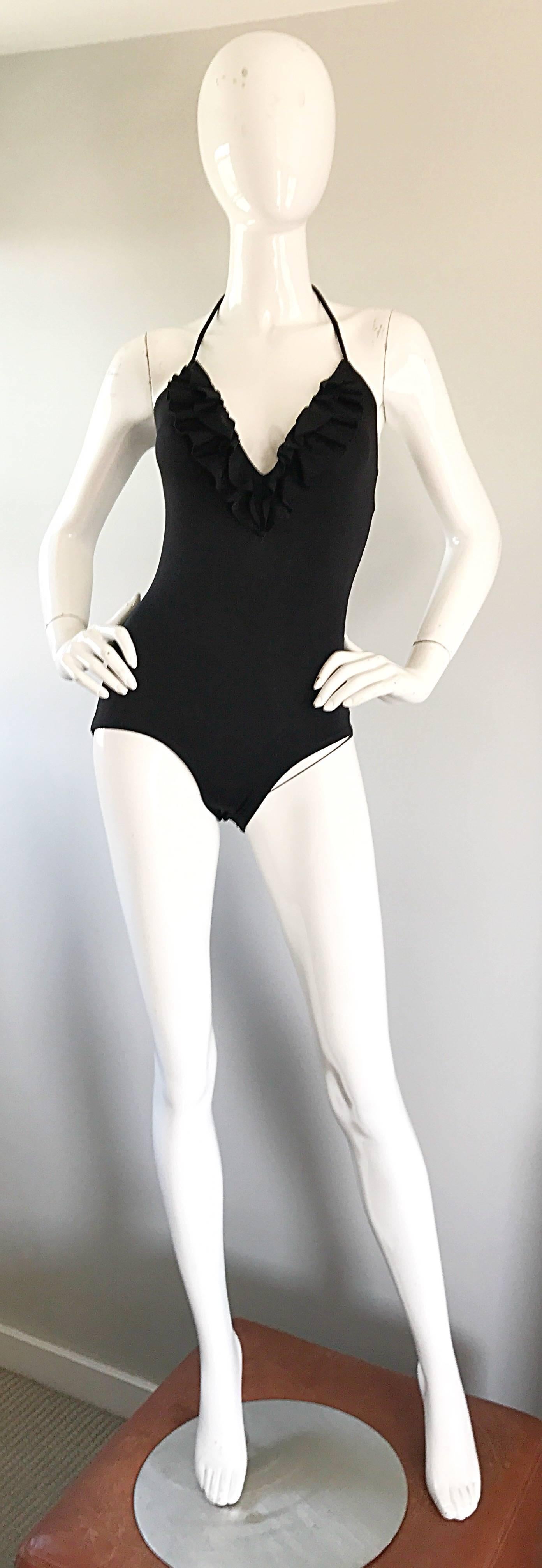 Sexy 70s vintage BILL BLASS black plunging ruffle neck halter swimsuit or bodysuit! Features flattering ruffles that help with the plunge. Ties at the back rear neck, and stretches to fit. Simply step into this classic beauty and tie. Great for the