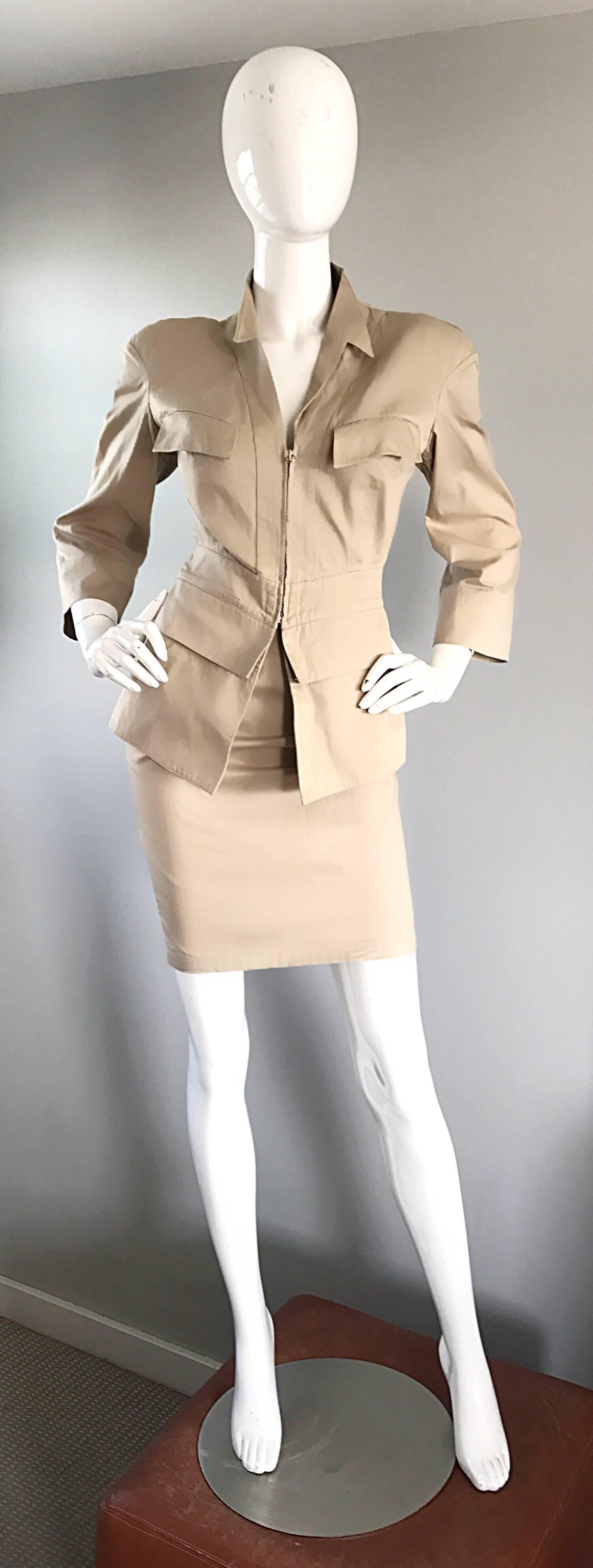 Iconic 1980s THIERRY MUGLER khaki / tan cotton safari power suit! Features a for fitting bodice that zips up the front middle. Pockets at both breasts and waist. Stron shoulders feature shoulder pads, which can easily be snipped out. High waisted