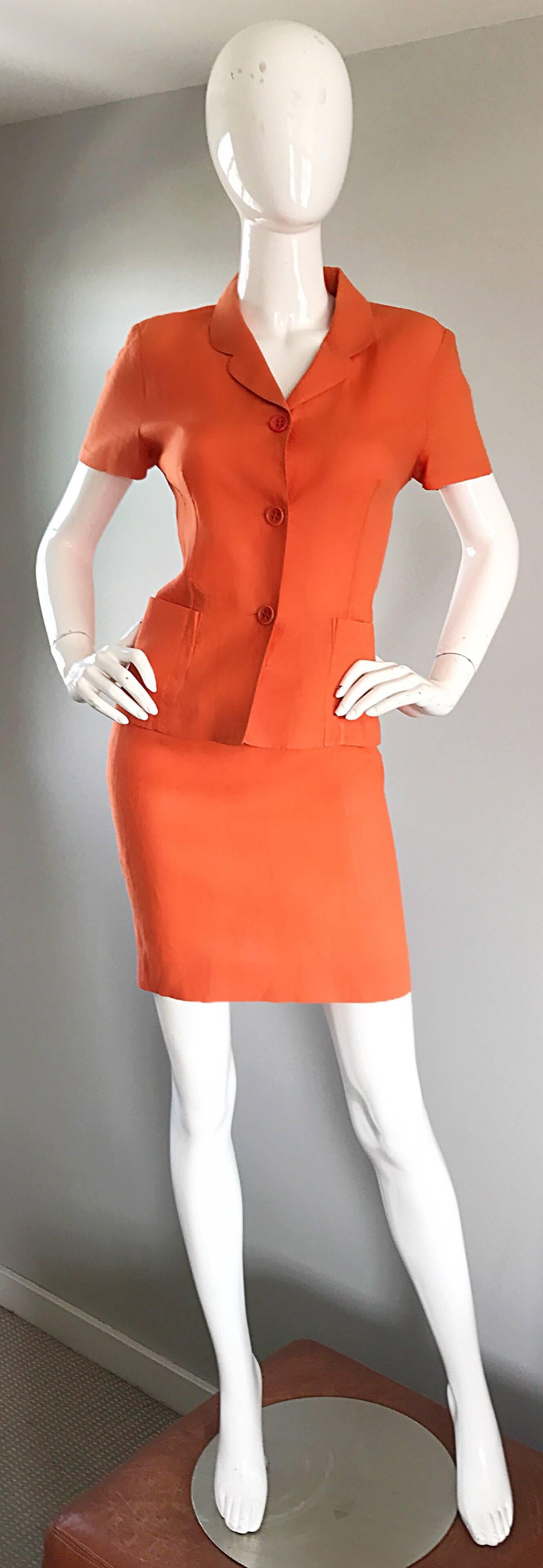 Chic 90s KENZO bright orange linen blend short sleeve skirt suit! Features a bright orange color on a luxurious linen (83%) and nylon (17%) blend. Buttons up the front, and ties in the back can adjust the size. Pocket at each side of the waist. High
