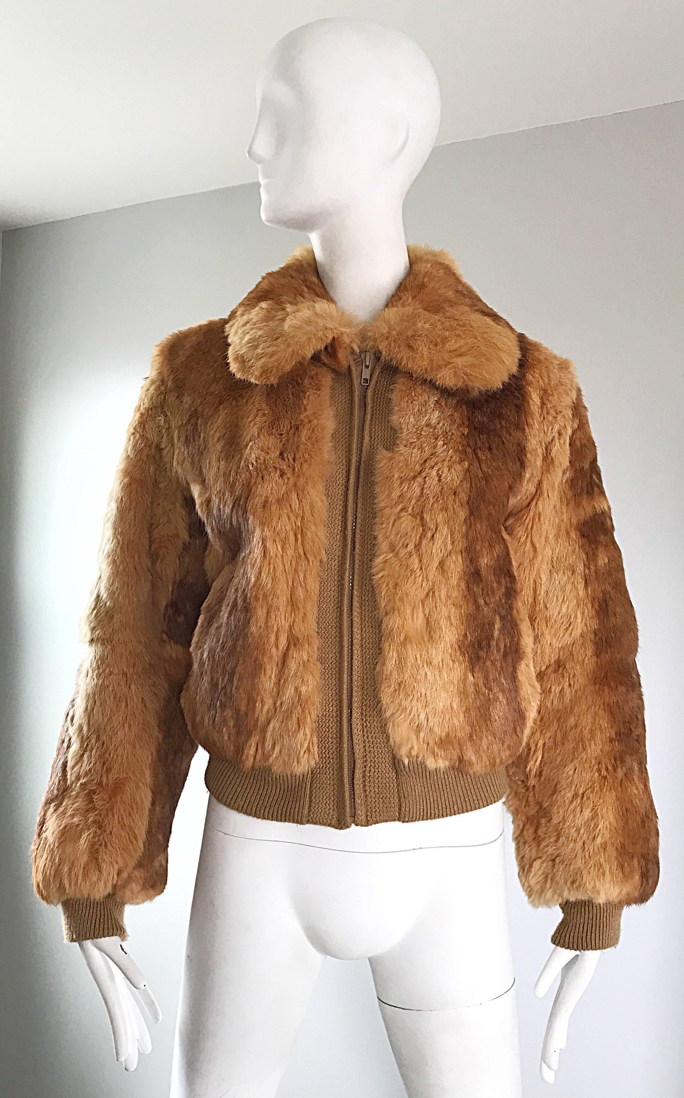Chic 1970s luxurious rabbit fur bomber style jacket! Classic brown / copper color literally matches everything. A classic silhouette with a fantastic fit! Full zipper up the front. Tan wool details and cuffs. Pockets at each side of the waist. Fully