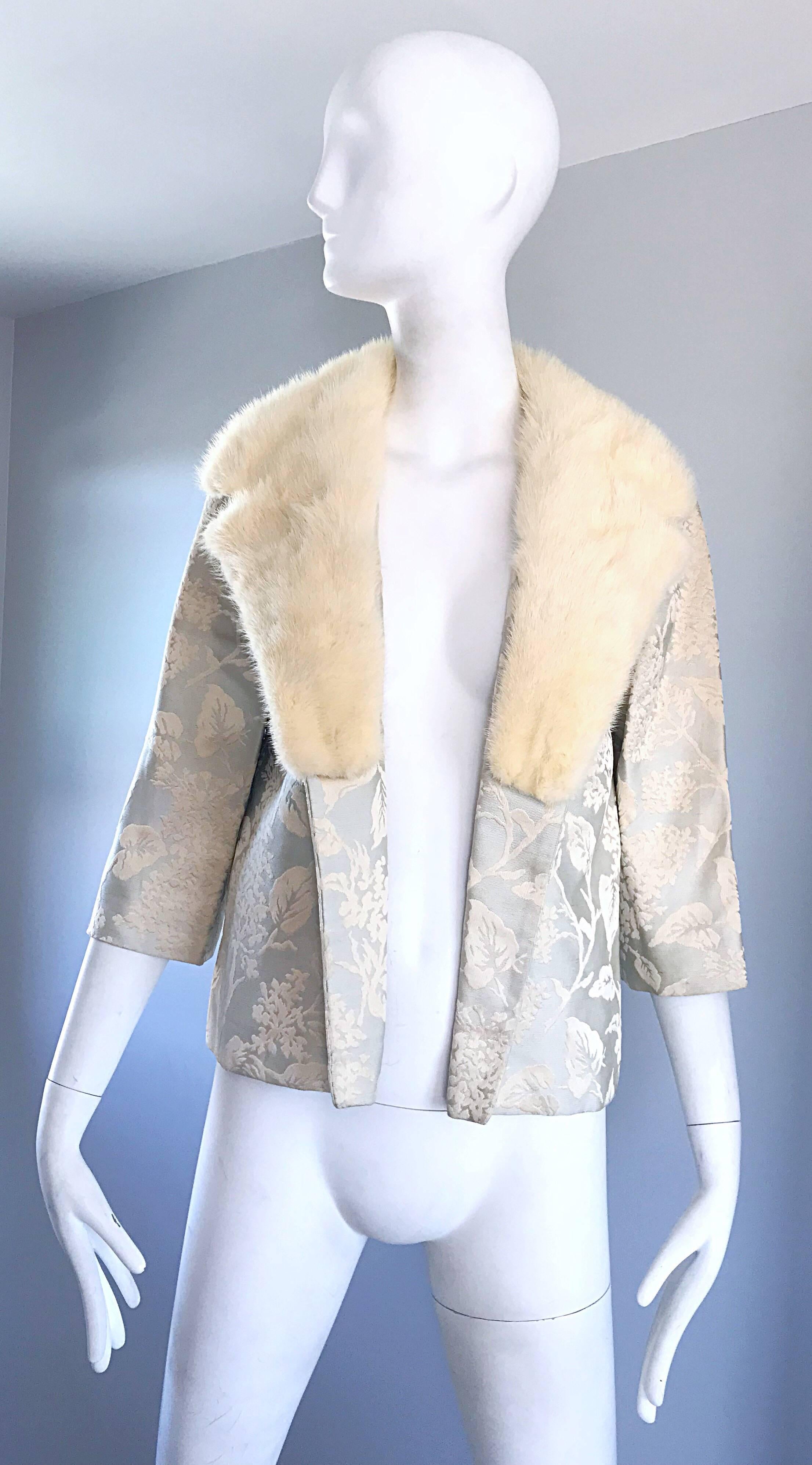 Gorgeous 1950s demi couture pale blue silk brocade jacket, with oversized white mink fur collar! Features a regal print, with a smart tailored frame, and 3/4 length sleeves. Chic open front makes this rare gem perfect for a belt. Fully lined in