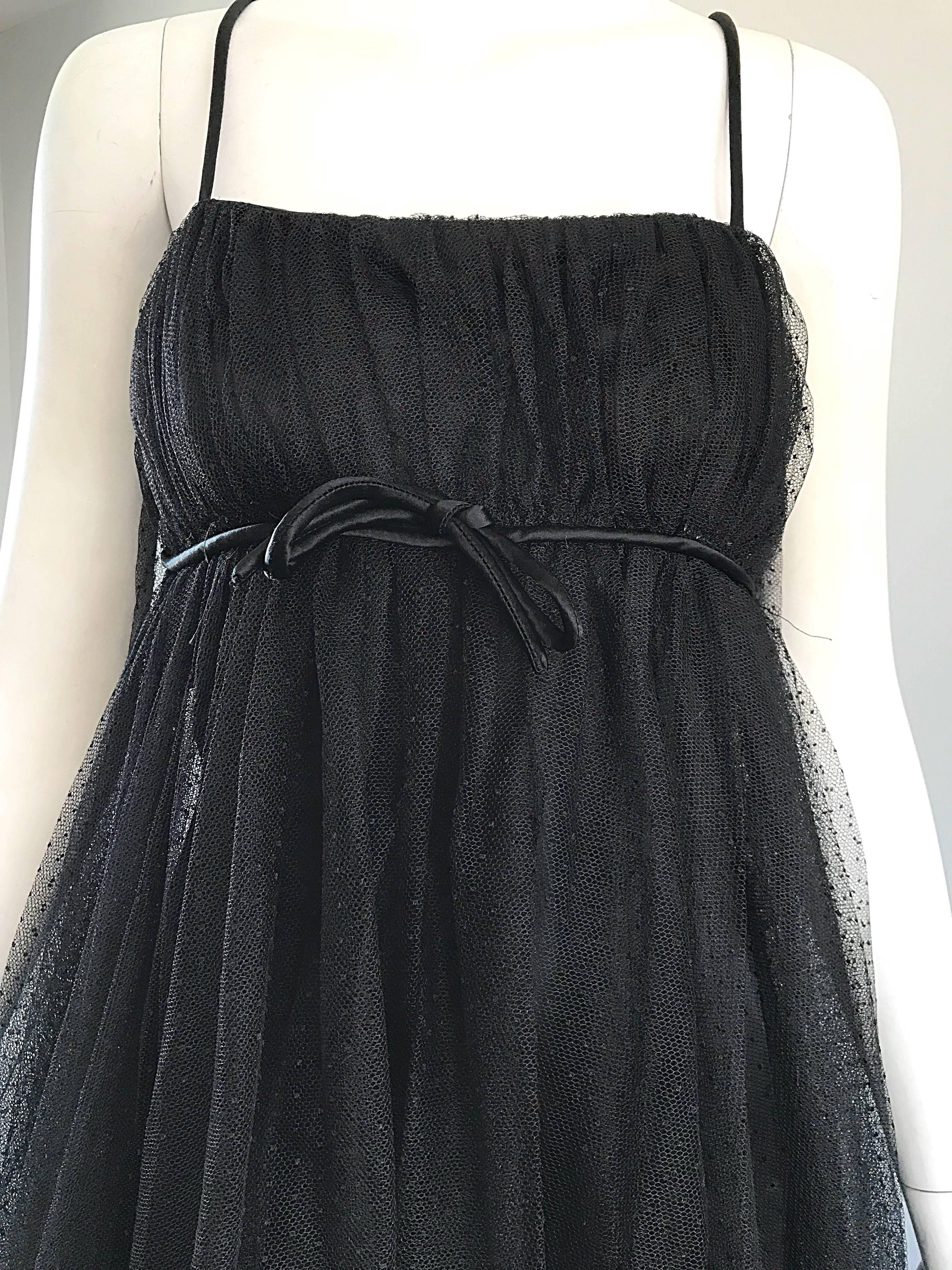 Sensational vintage 60s SUZY PERETTE black silk and tulle trapeze cocktail dress! Features a black silk sheath underlay, with layers of black tulle. Empire waist, with small bow below center bust. Full metal zipper up the side with hook-and-eye