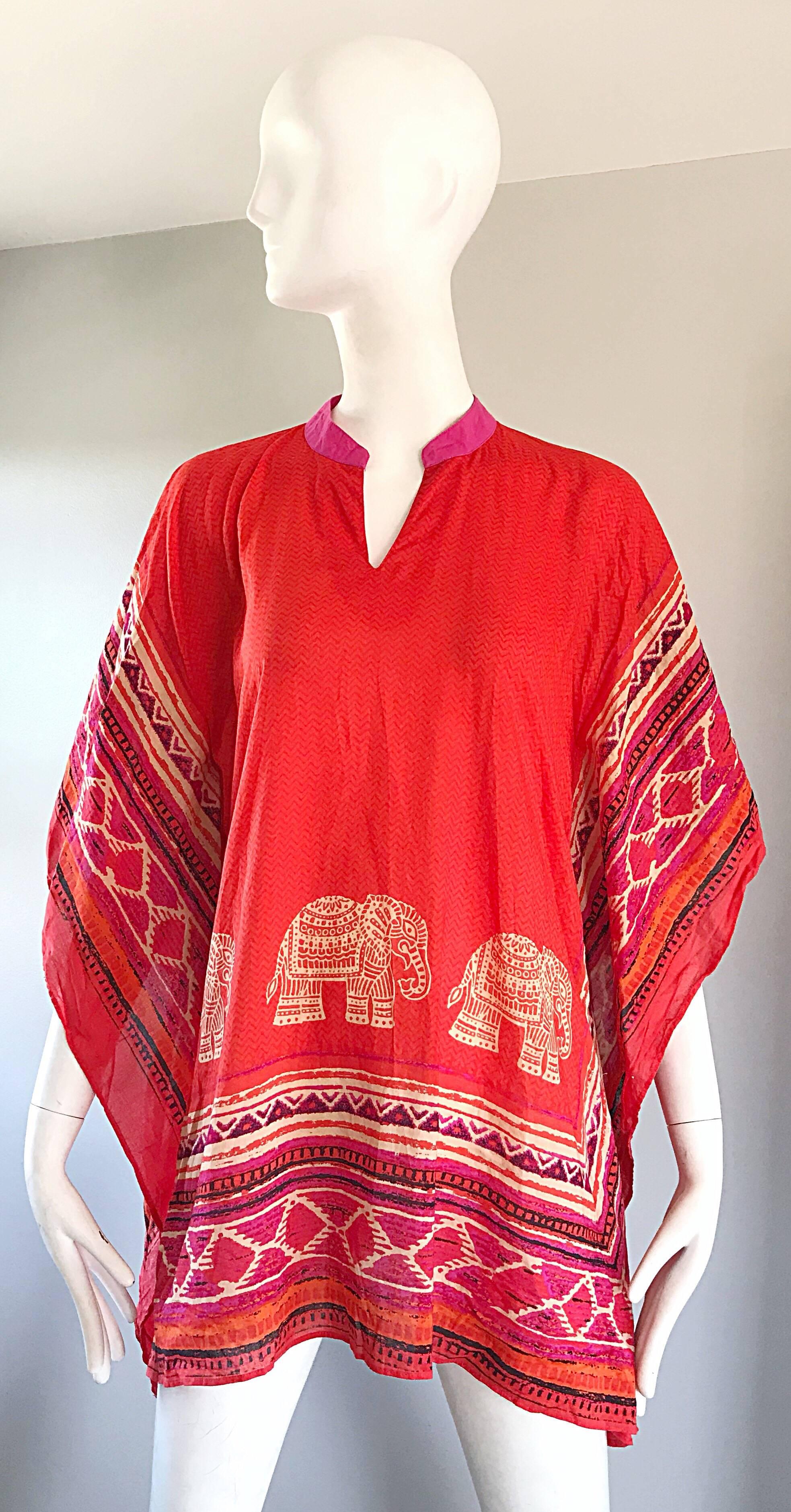 Chic 1970s BIBA lightweight cotton novelty print cotton kaftan tunic blouse! Features vibrant colors of bright orange, hot pink, tan, and fuchsia throughout. Zig zag print of orange and pink on the main body. Fun elephant print on the front and back