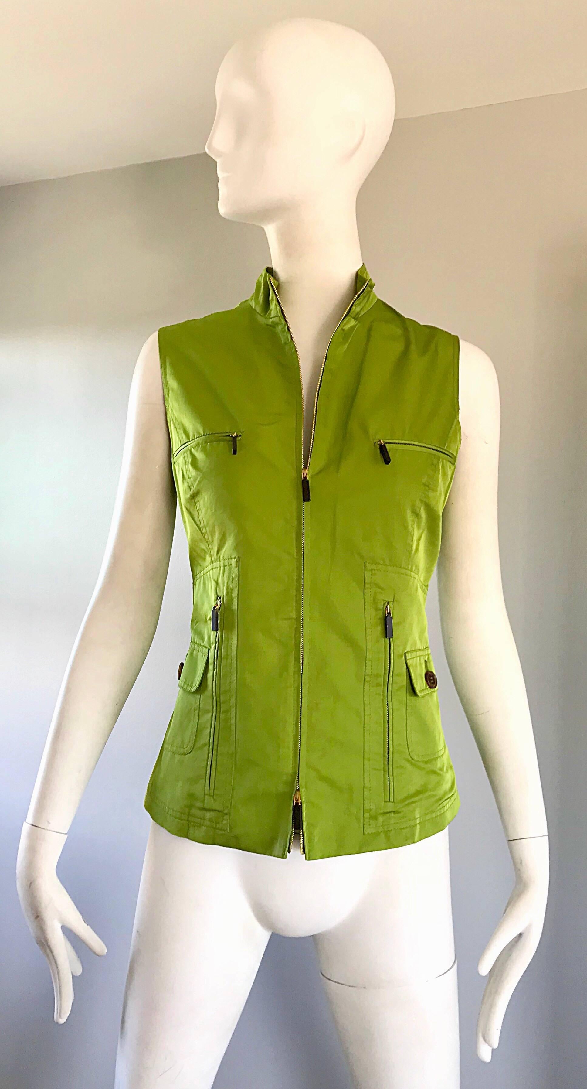 Chic mid 1990s never worn CAROLINA HERRERA 
Size 8 lime green cargo vest! Wonderful tailored fit, with four buttoned pockets on the front. Luxurious silk (55%) and cotton (45%) makes for the perfect weight. Zipper up the front. Great alone or