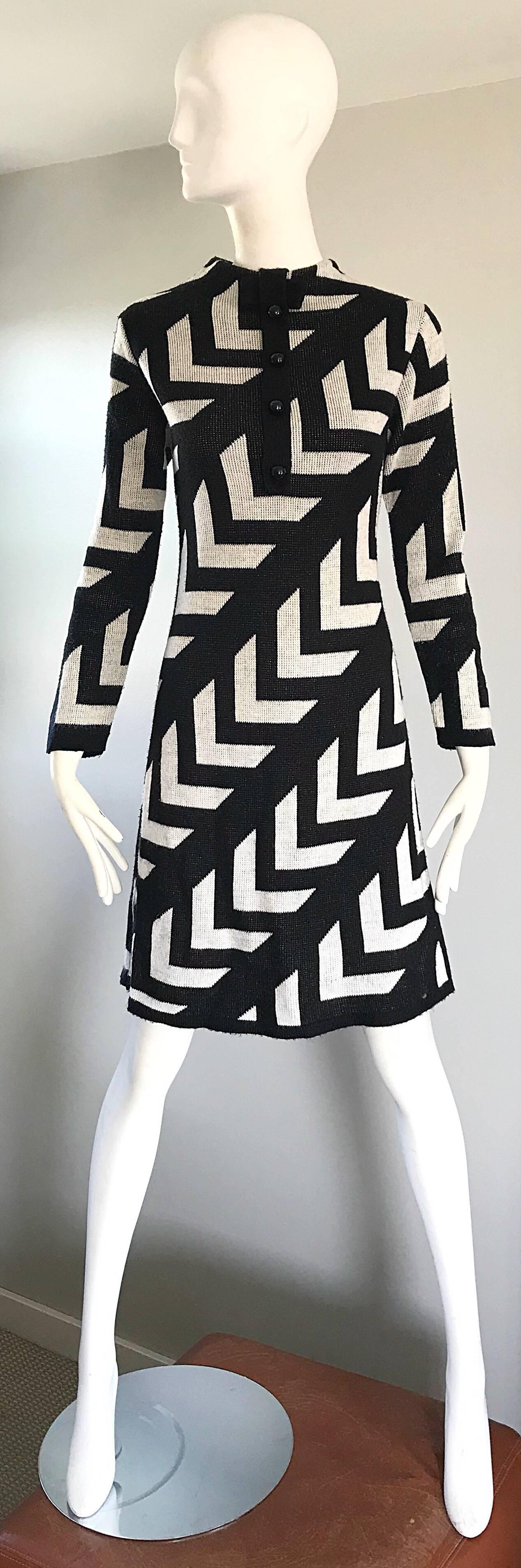 Chic 1960s black and white long sleeve soft wool knit Intarsia print sweater dress! Features a zig zag print, with diagonal black stripes. Fitted bodice, with four black lacquer mock buttons at center front neck, and a slight A-Line skirt. Hidden
