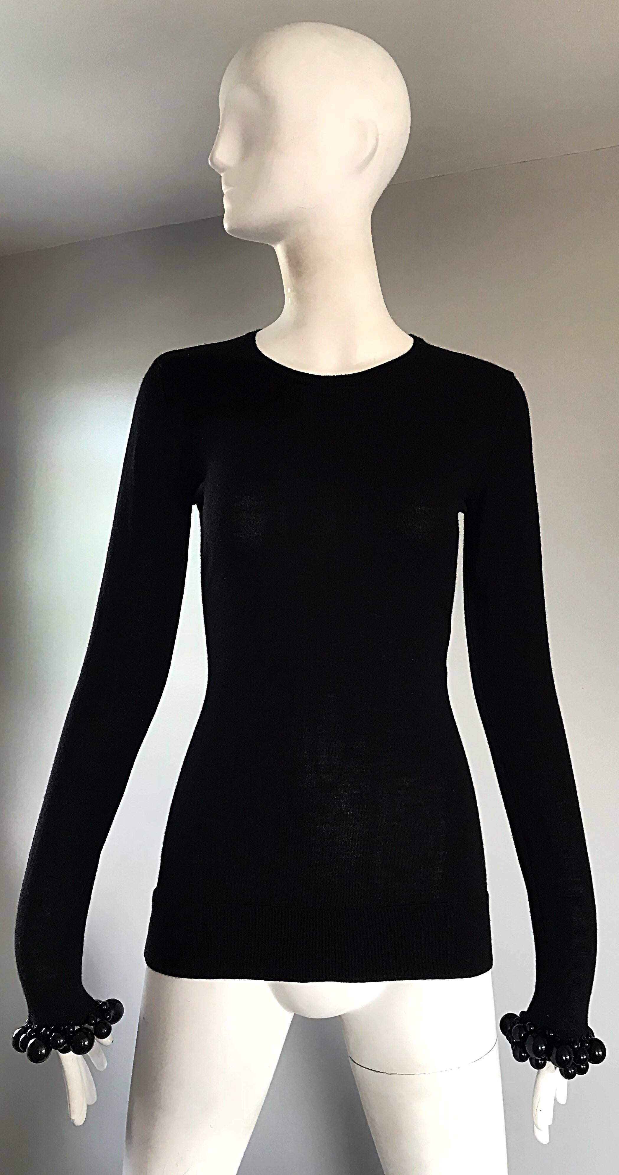 New with original tags BURBBERY PRORSUM black wool sweater, with large exaggerated black lacquer balls / beads at each sleeve cuff! Super soft virgin wool, and a smart tailored fit that stretches to fit. Can easily be dressed up or down. Great with