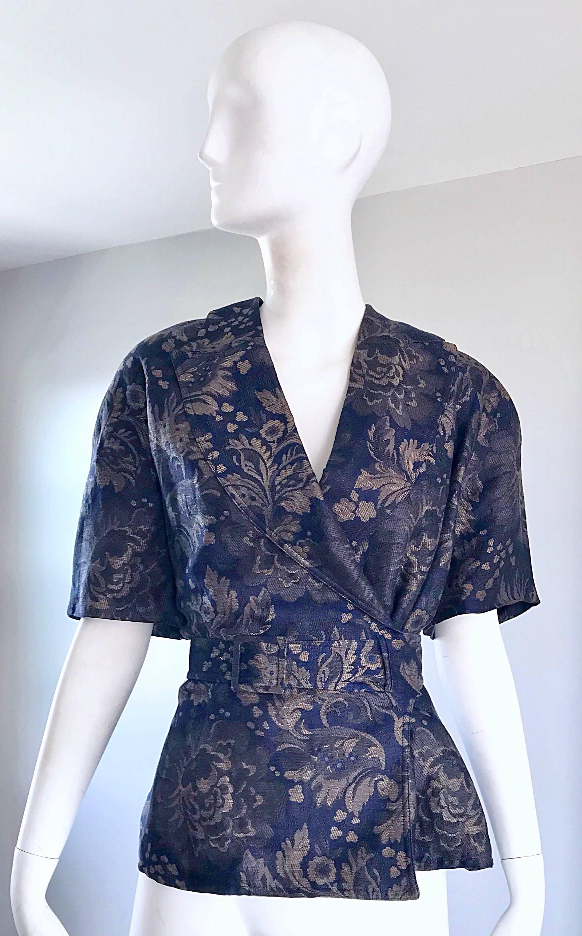 Rare 80s vintage GUCCI navy blue and taupe short sleeve belted kimono style jacket / top! Features a rich navy blue color, with taupe floral pattern. Attached belt wraps around and loops through a slit on the side. Interior buttons to ensure