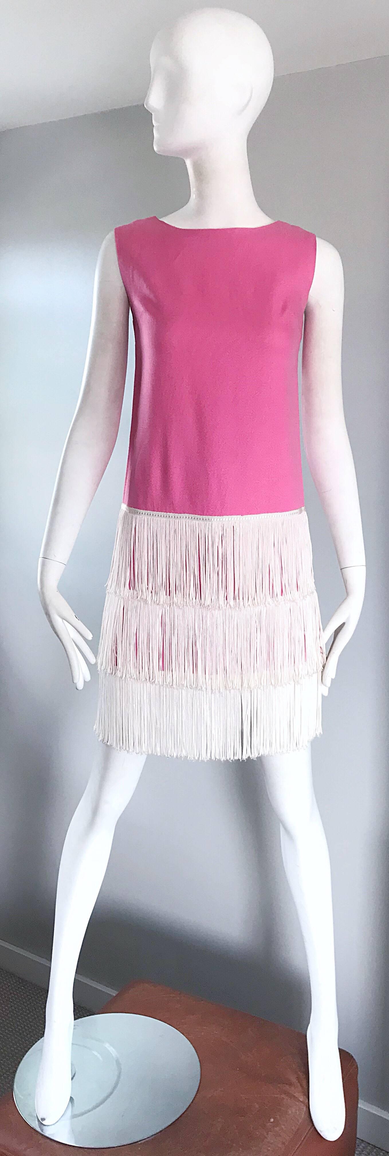 Amazing 60s does 20 bubblegum pink and white sleeveless flapper style fringed flapper style shift dress! Soft textured cotton, with three tiers of white fringe at the hem. Full metal zipper up the back with hook-and-eye closure. Very well made, with