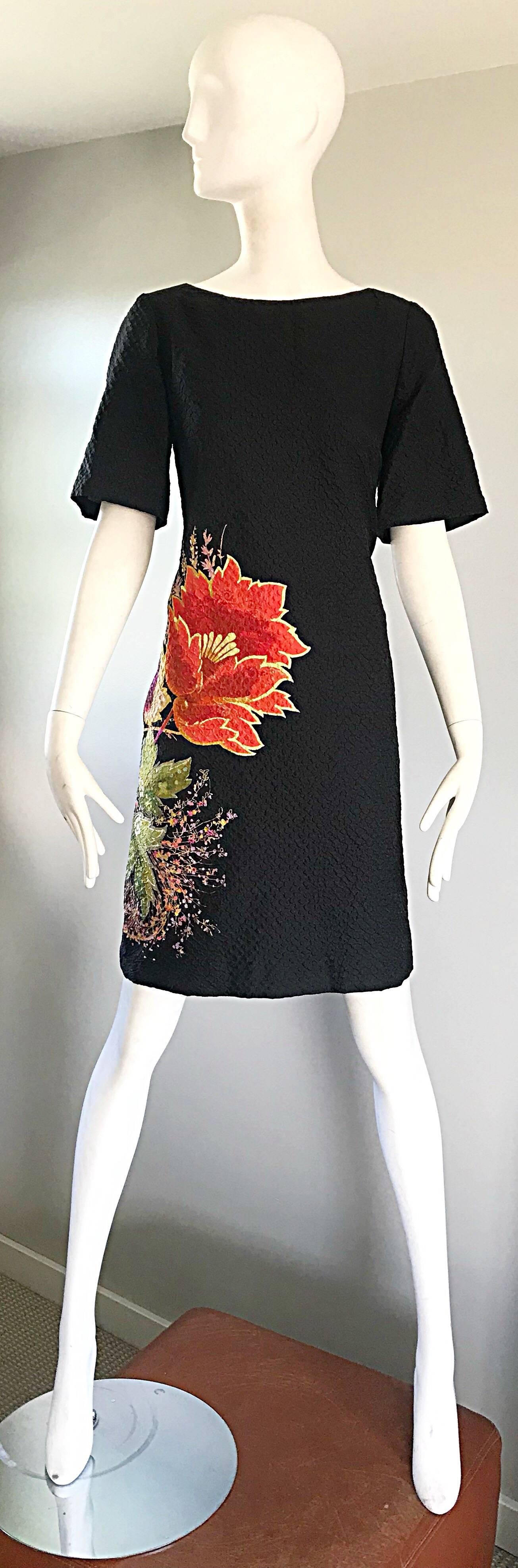 Chic 1990s ETRO short bell sleeve textured silk shift sac dress with POCKETS! Features a jet black background, with a colorful flower print in red, pink, yellow, purple and green on the side front and back. Hidden zipper up the back with
