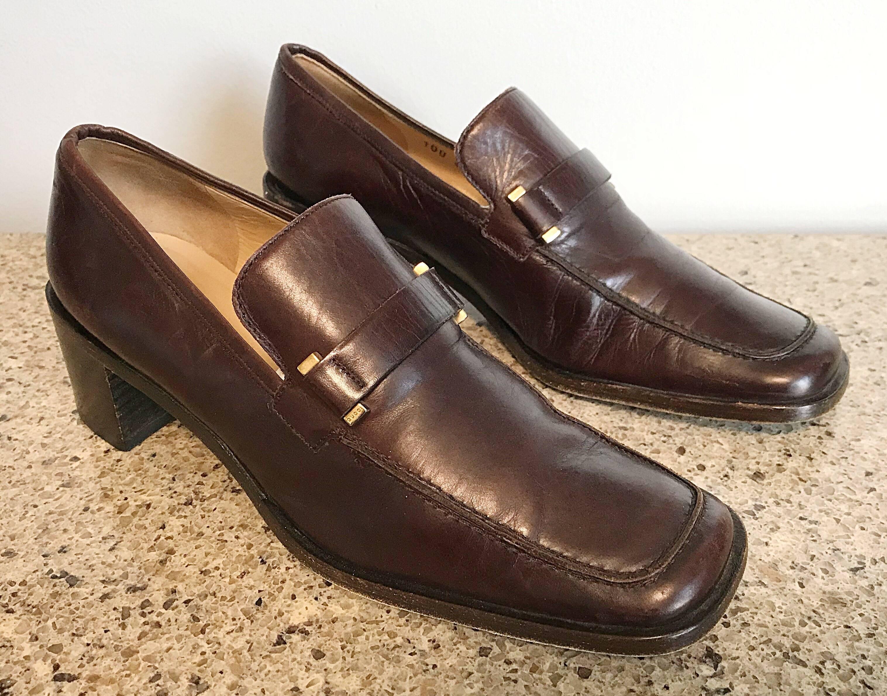 Classic pair of vintage Gucci leather stacked heel loafers from Tom Ford's first collection with Gucci in 1996! Rich chocolate color pairs nicely with nearly everything. Brass hardware. These 90s gems can easily be dressed up or down. Great with